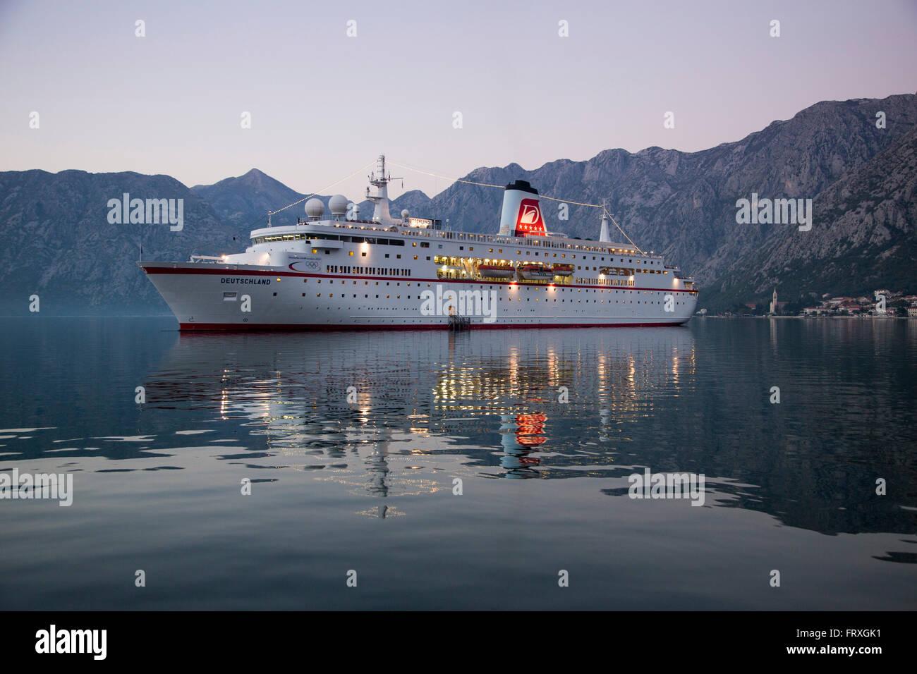 Cruise ship MS Deutschland, Reederei Peter Deilmann, in Kotor Fjord at dusk, Kotor, Montenegro Stock Photo
