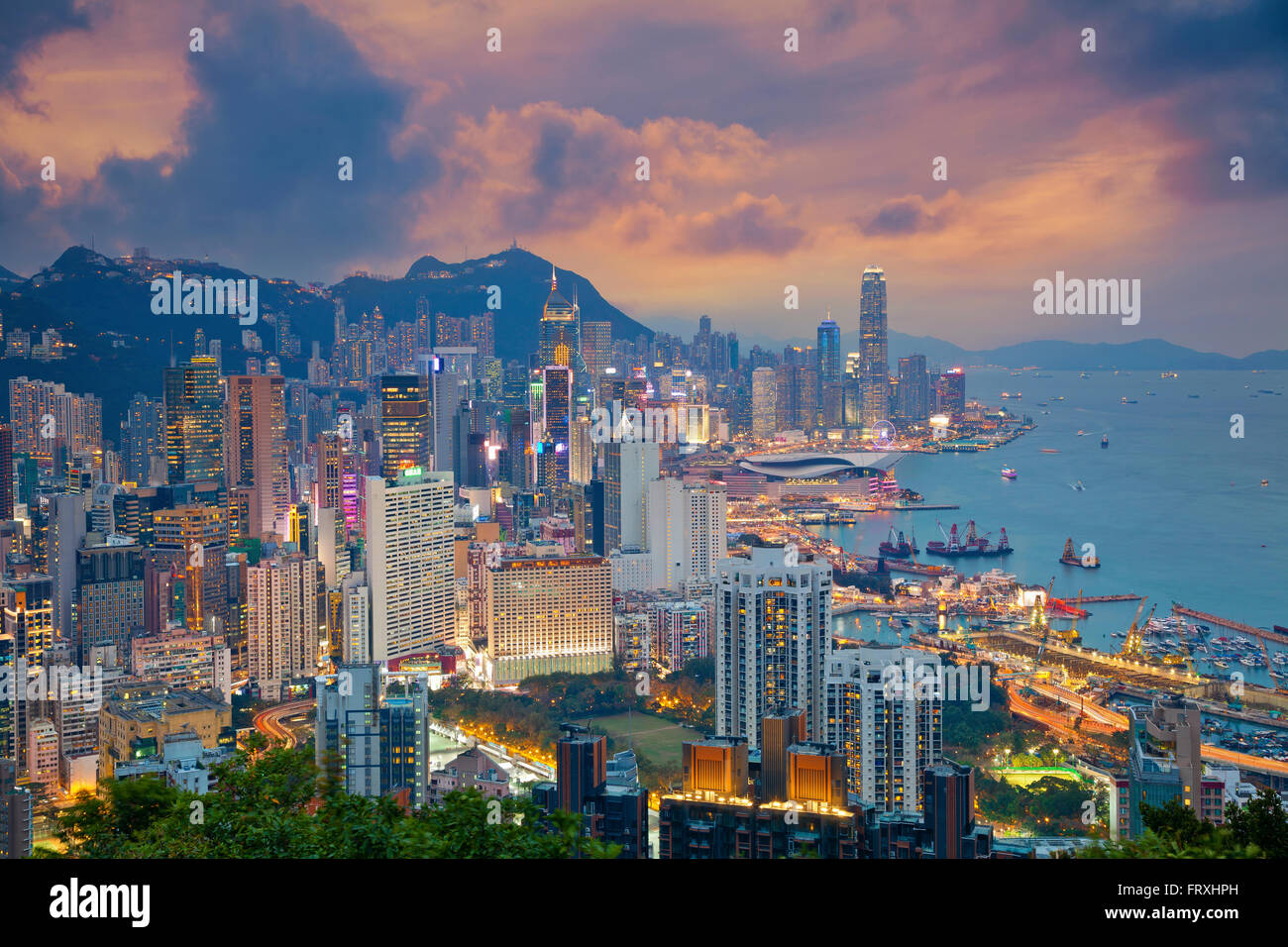 Hong Kong. Image of Hong Kong skyline during dramatic sunset. Stock Photo