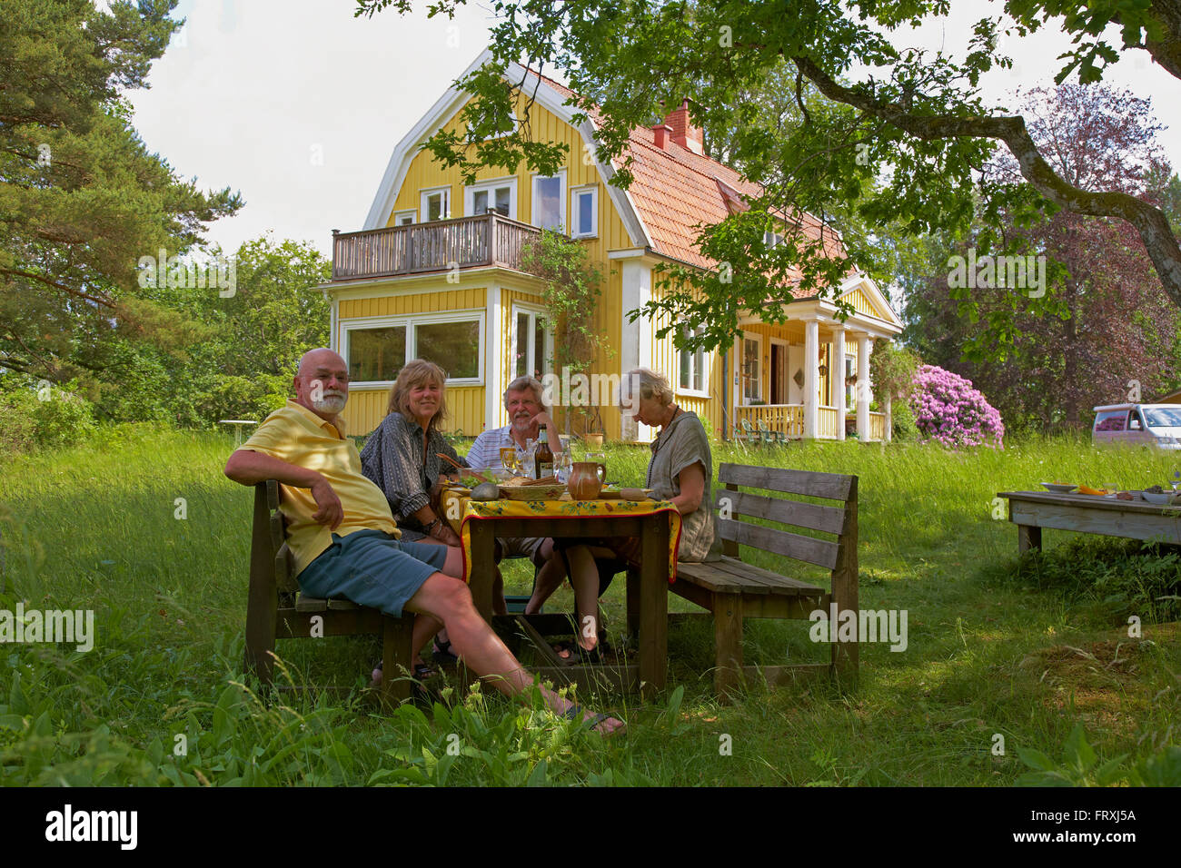 Lunch in the garden, Vaestra Bodarne, Mjoern, Province of Bohuslaen, West coast, Sweden, Europe Stock Photo