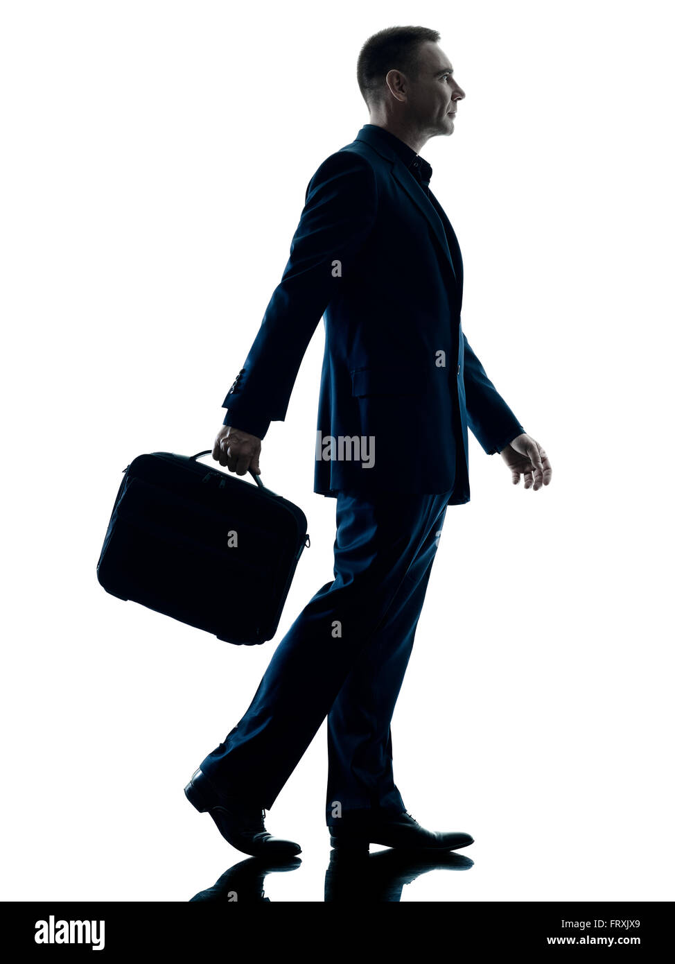 one caucasian business man walking side view silhouette isolated on white background Stock Photo
