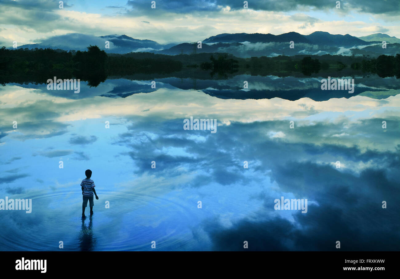 Boy walking in peace lake concept art Stock Photo