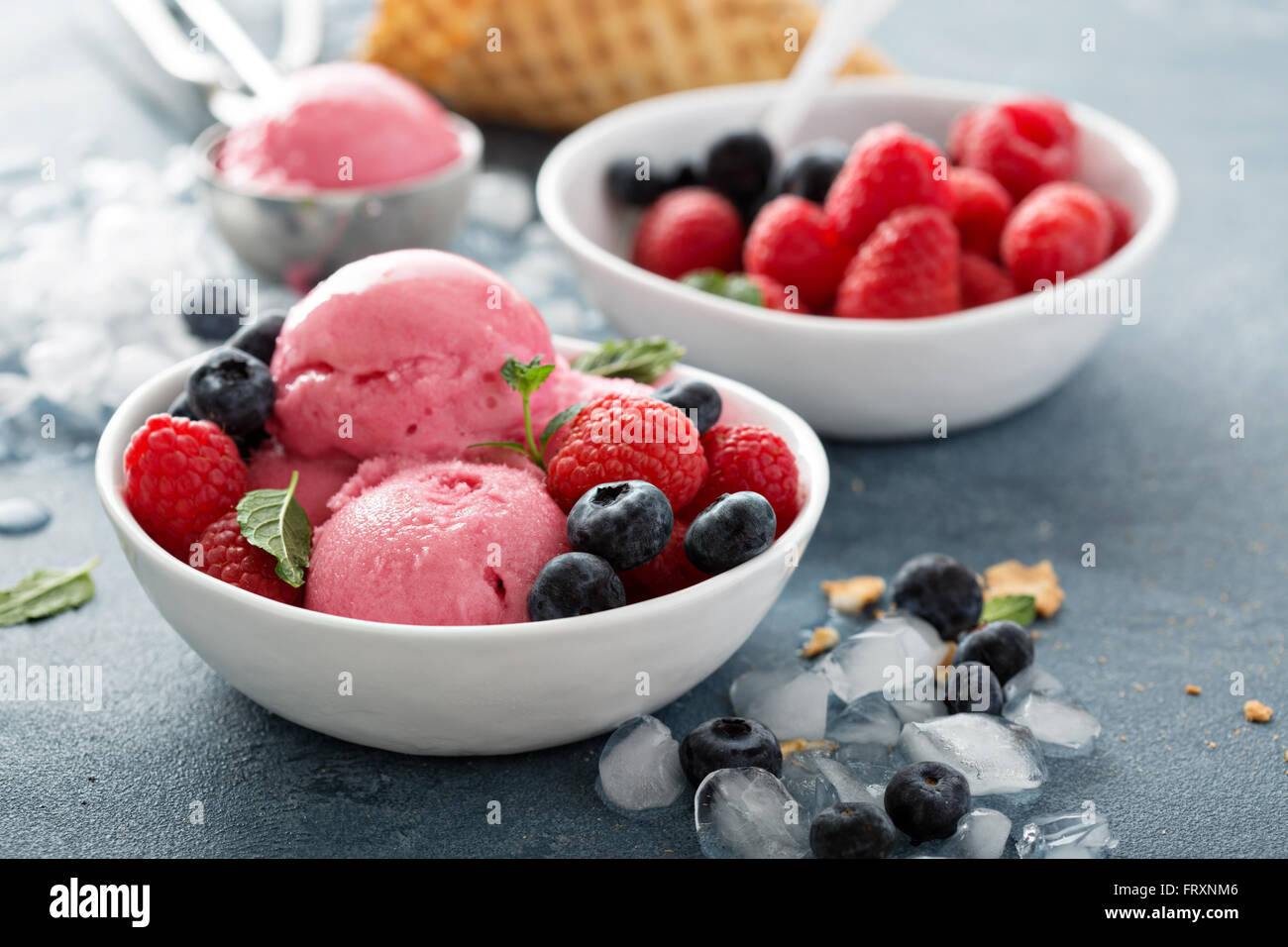 Raspberry ice cream in white bowl Stock Photo