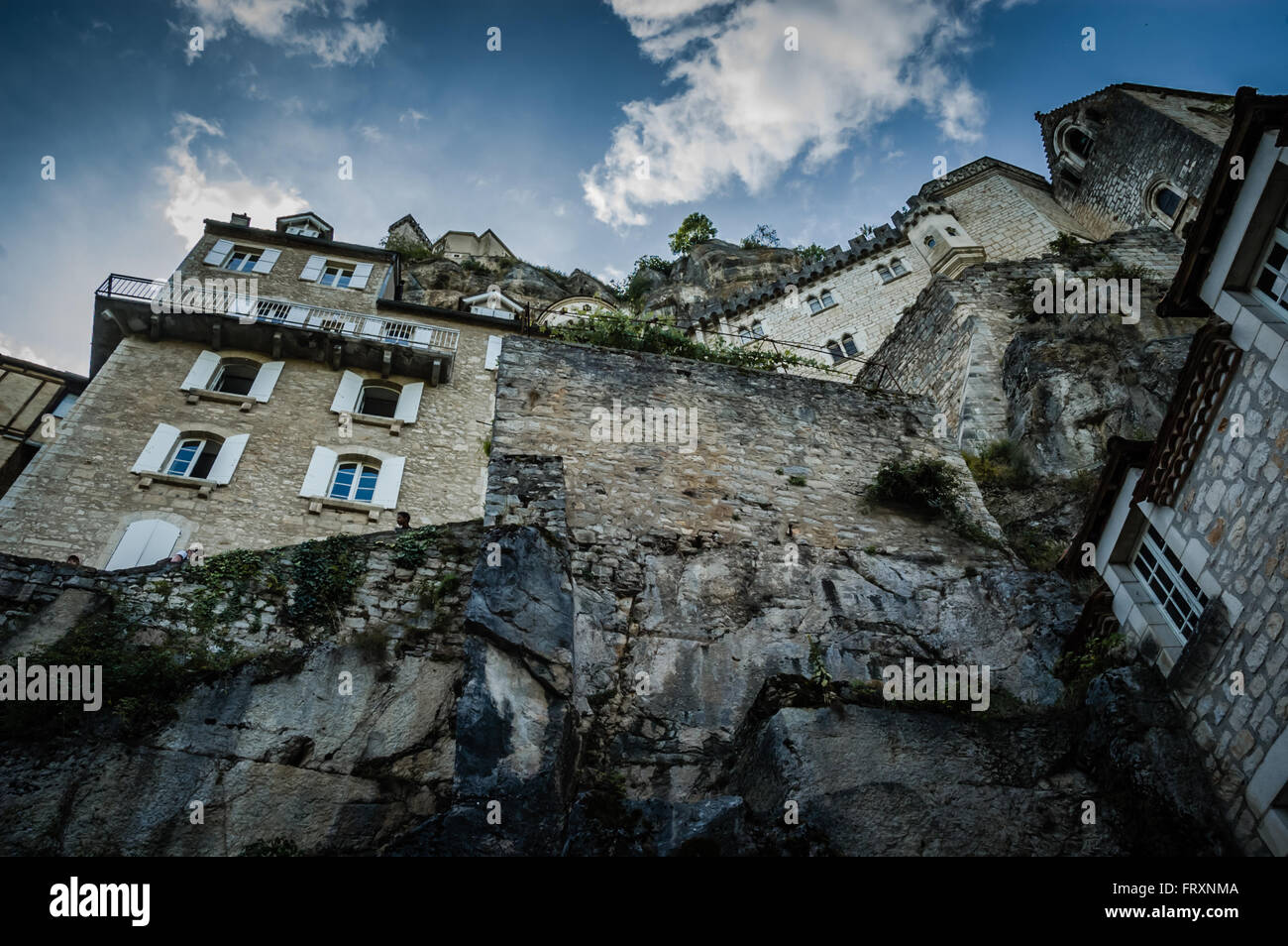 Villas built into a cliff, looking skywards Stock Photo