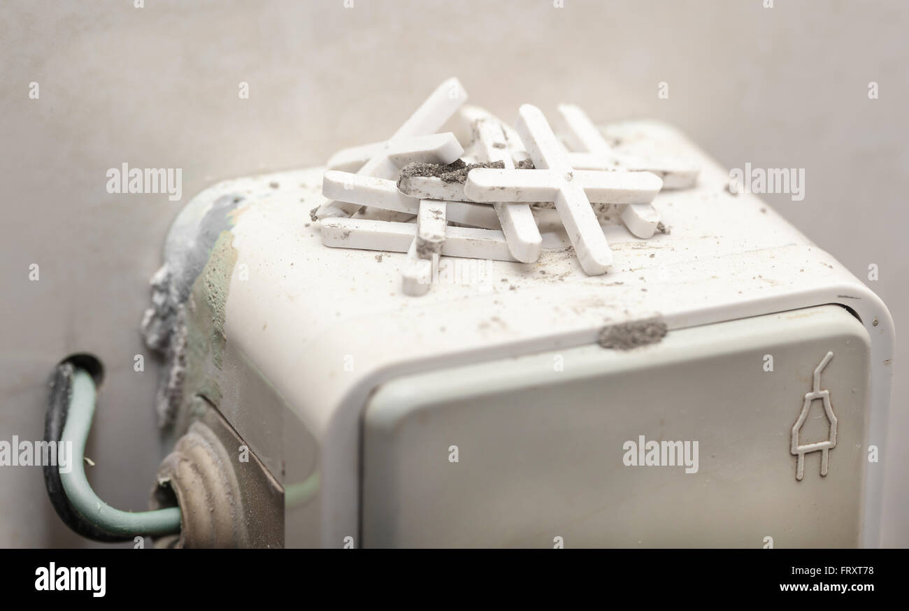 Tile Socket socket and crosses for ceramic tiles closeup Stock Photo - Alamy