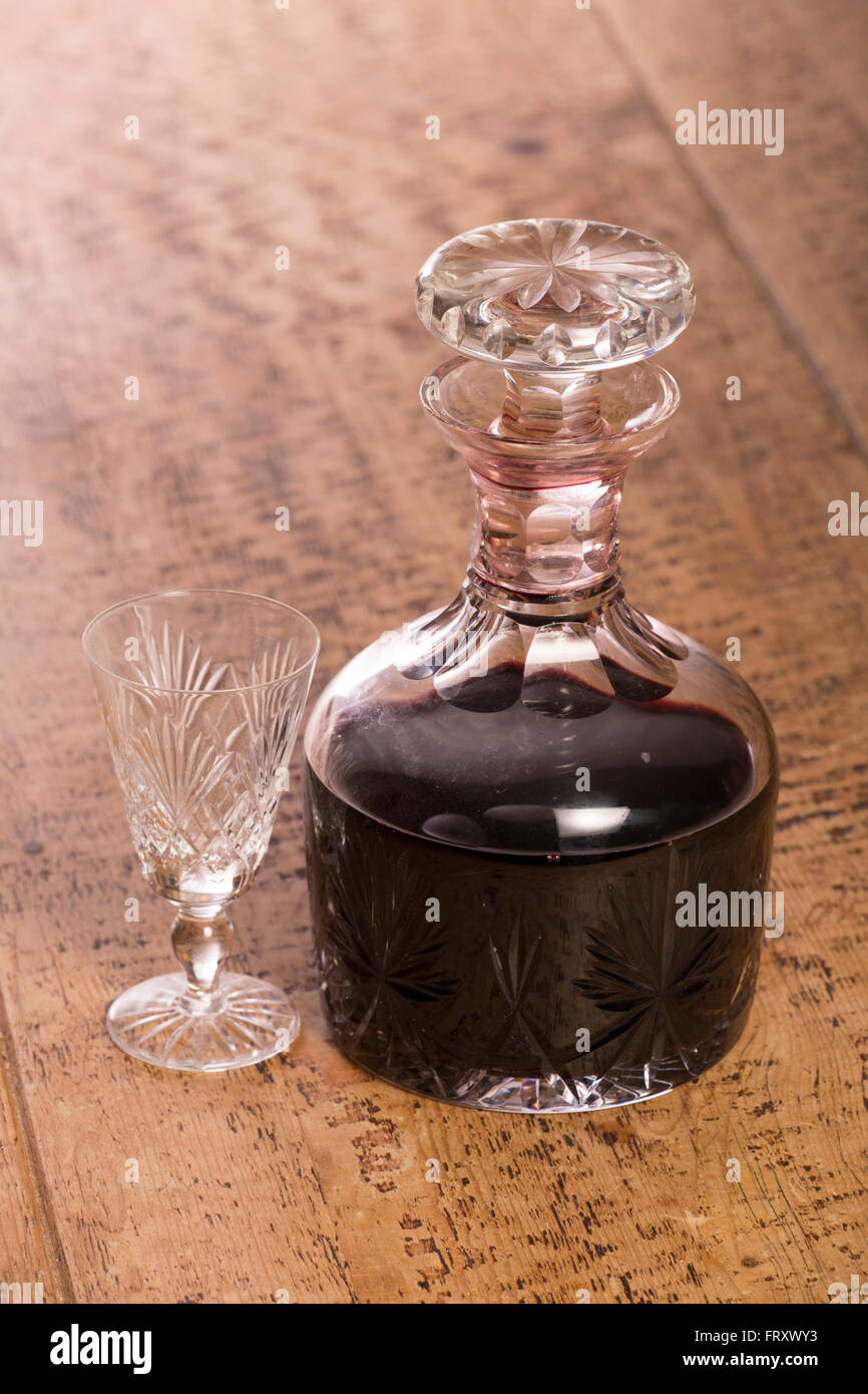 port in a decanter on wooden table Stock Photo Alamy