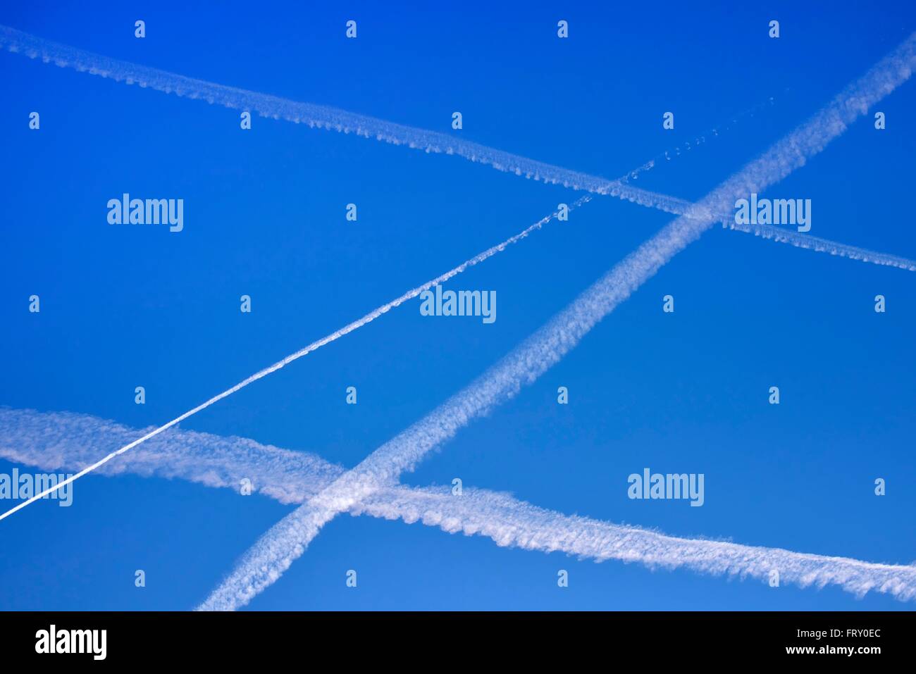 Contrails of jet aircrafts in the blue sky, Germany Stock Photo