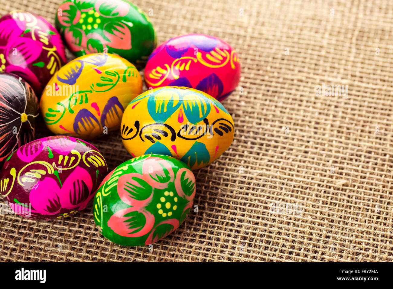 Beautiful background with Easter eggs laid out on a burlap background ...