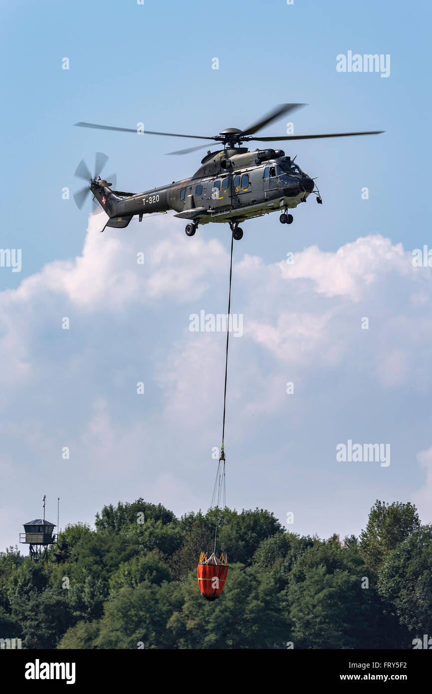 Aerospatiale AS332 (TH89) Super Puma Military helicopter from the Swiss Air  Force with a bambi bucket for aerial fire fighting Stock Photo - Alamy