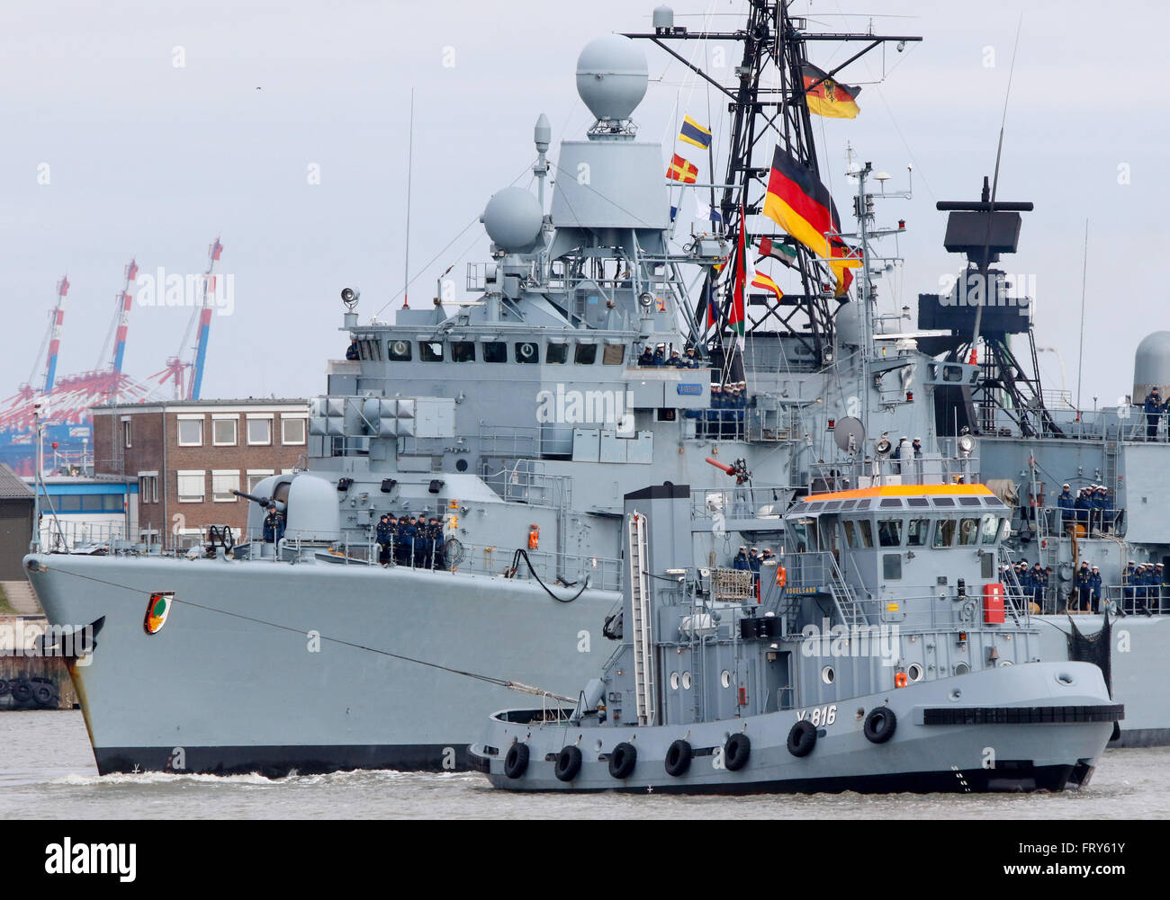 Wilhelmshaven, northern Germany, March 24, 2016: A tug boat tows the ...