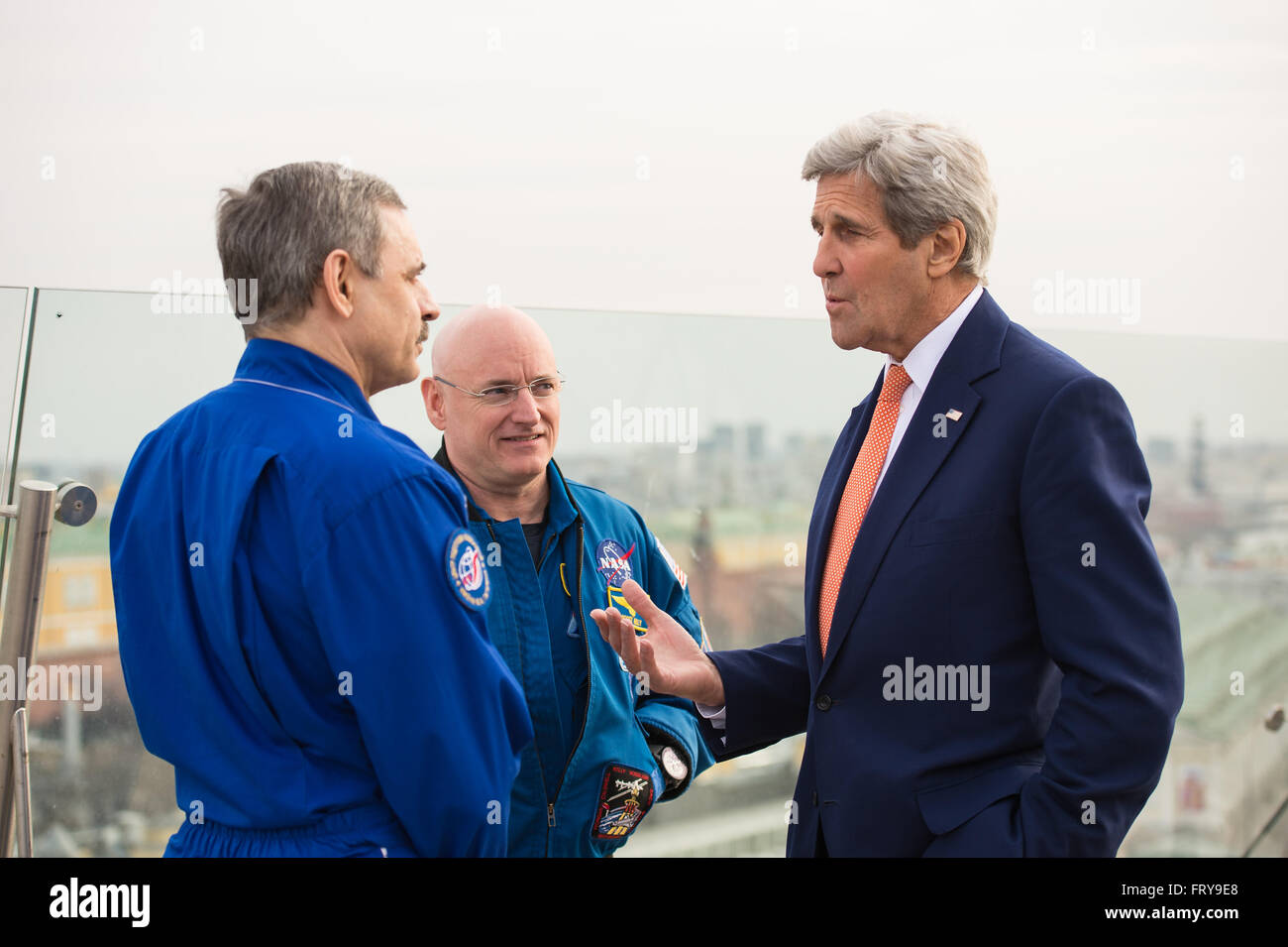 Moscow, Russia. 24th March, 2016.  U.S Secretary of State John Kerry talks with NASA astronaut Scott Kelly, center, and Russian cosmonaut Mikhail Kornienko during a meeting March 24, 2016 in Moscow, Russia. Kerry took a break from meetings on Syria to join the space travelers to discuss their record year-long stay aboard the International Space Station. Credit:  Planetpix/Alamy Live News Stock Photo