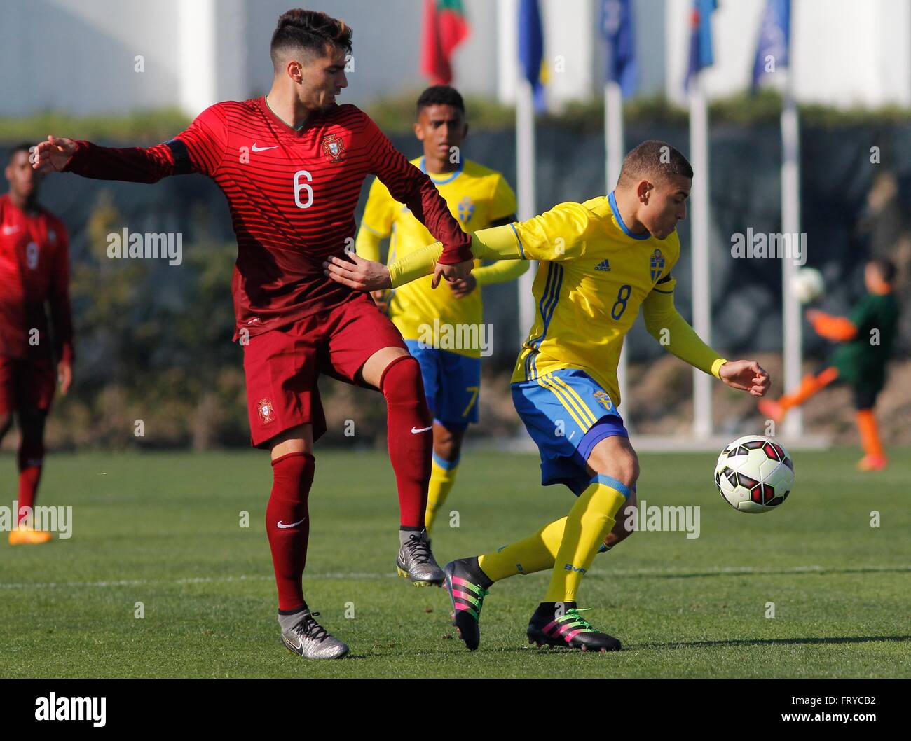 Vila Do Conde, Portugal. 24th Mar, 2016. Pedro Rodrigues of Portugal (Left)  and Jordan Larsson of Sweden in action during their Euro 2016 Under-19  Elite qualifying round at Rio Ave stadium, where
