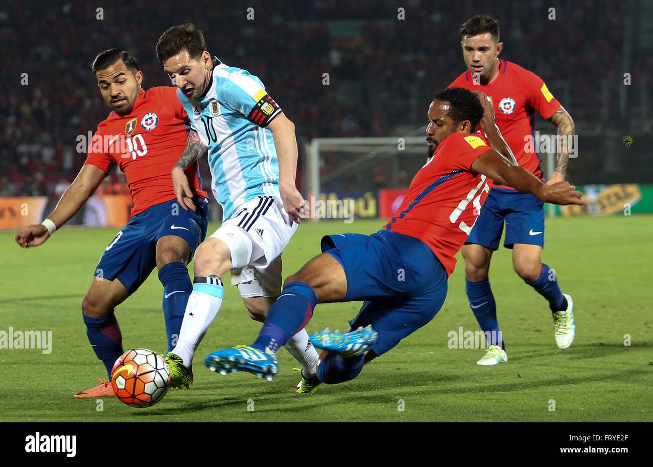 Santiago, Chile. 24th Mar, 2016. Image provided by Chile's National Football Association shows Chile's Jean Beausejour (2nd R) vying with Argentina's Lionel Messi (2nd L) during the qualifying match for the Russia 2018 FIFA World Cup at the National Stadium in Santiago, capital of Chile, on March 24, 2016. Argentina won 2-1. Credit:  ANFP/Xinhua/Alamy Live News Stock Photo