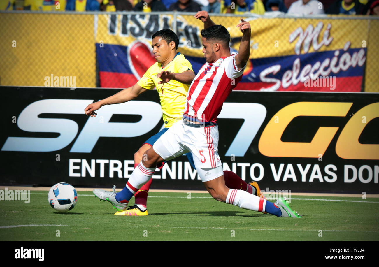 Quito, Ecuador. 24th Mar, 2016. Ecuador's Antonio Valencia (L) vies with Paraguay's Bruno Valdez during the qualifying match for the Russia 2018 World Cup at the Atahualpa Olympic Stadium in Quito, capital of Ecuador, on March 24, 2016. The match ended with a 2-2 draw. © Santiago Armas/Xinhua/Alamy Live News Stock Photo