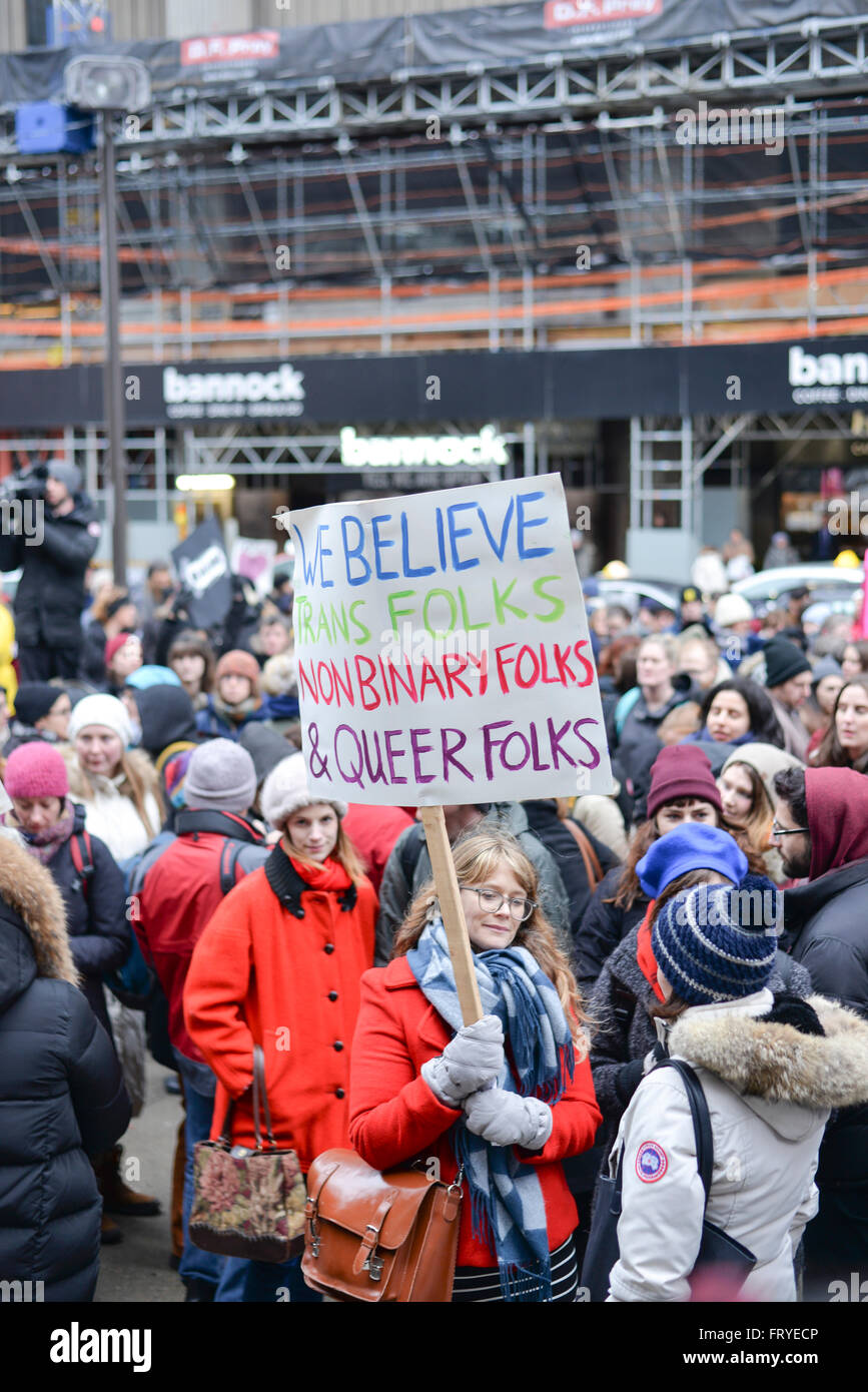 Toronto, Canada. 24th March, 2016. Hundreds marched to police headquarters Thursday evening, just hours after Jian Ghomeshi was found not guilty of sexually assaulting three women. At least 300 people, including men and women, walked from Old City Hall to Toronto Police headquarters, joining up with a group of Black Lives Matter Toronto protesters. Chants of “We believe survivors!” and “Our bodies, our lives, we will not be victimized!” filled the air. Credit:  NISARGMEDIA/Alamy Live News Stock Photo