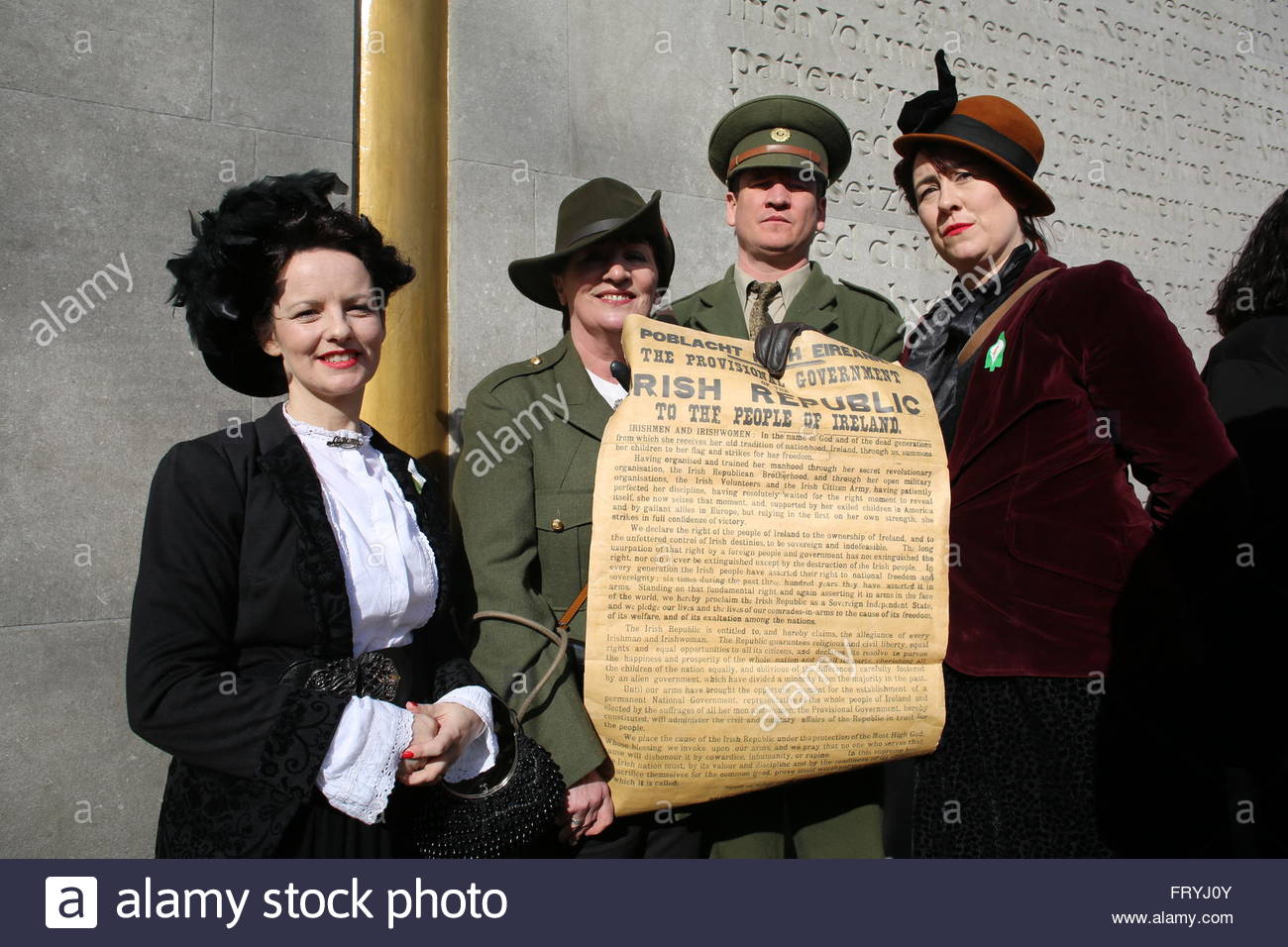 Dublin, Ireland. 25th March, 2016. Participants in the Sinn Fein 1916 centenary rally hold a copy of the proclamation of irish Independence in Dublin today Credit:  reallifephotos/Alamy Live News Stock Photo