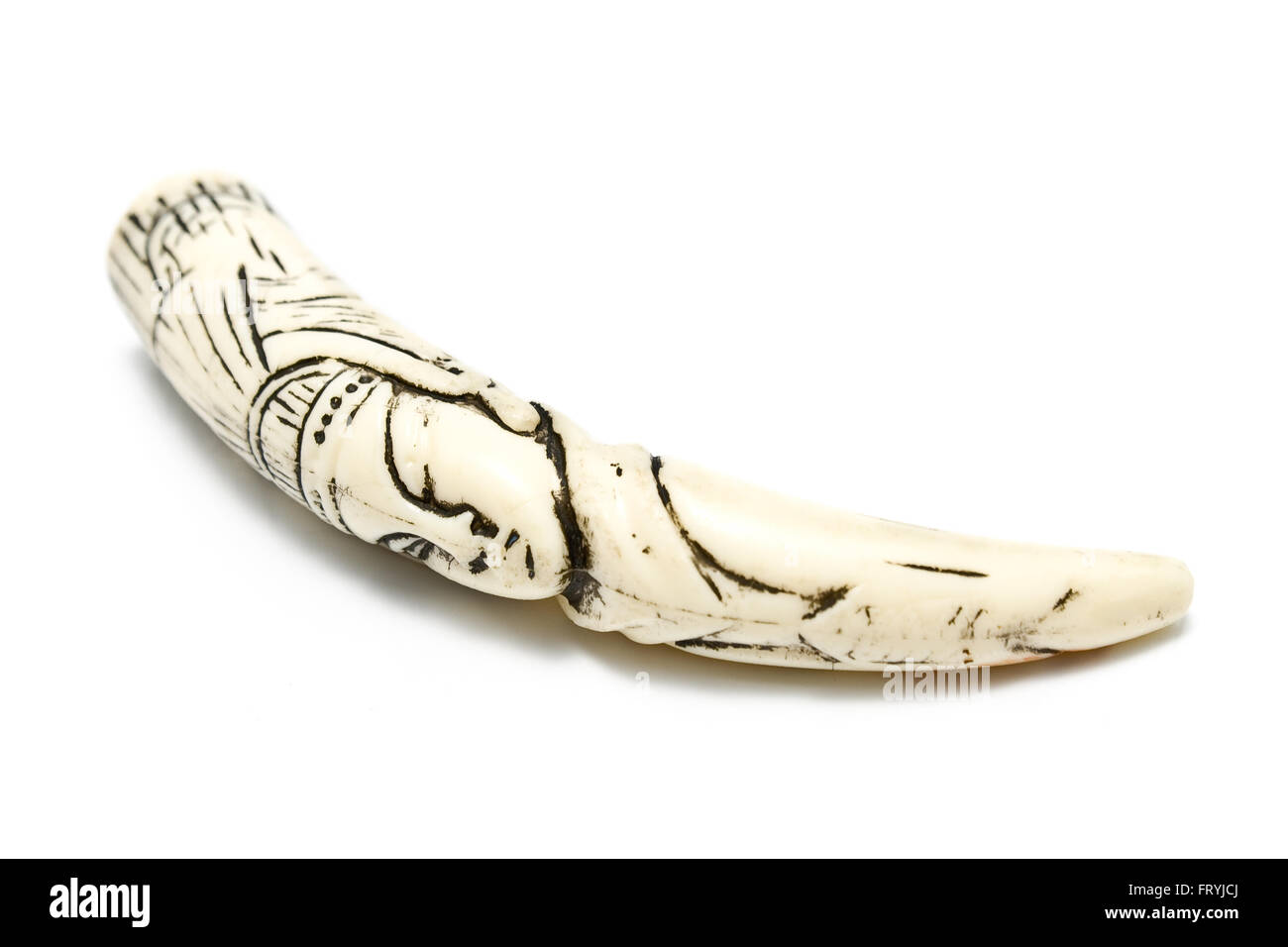 Carved ivory tusk isolated on white Stock Photo