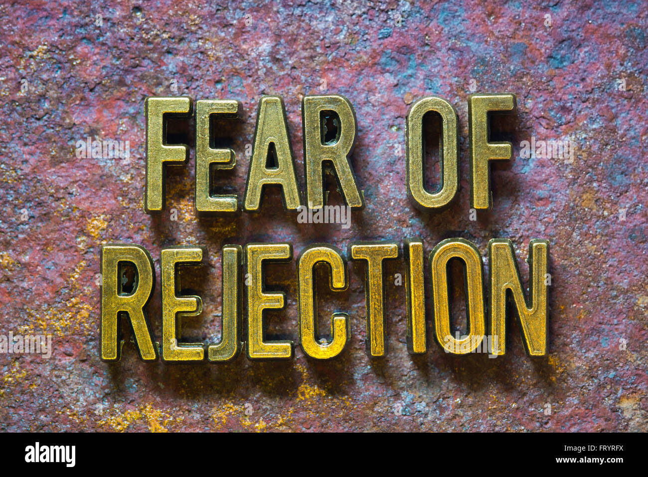 fear of rejection phrase made from metallic letters over rusty metallic background Stock Photo