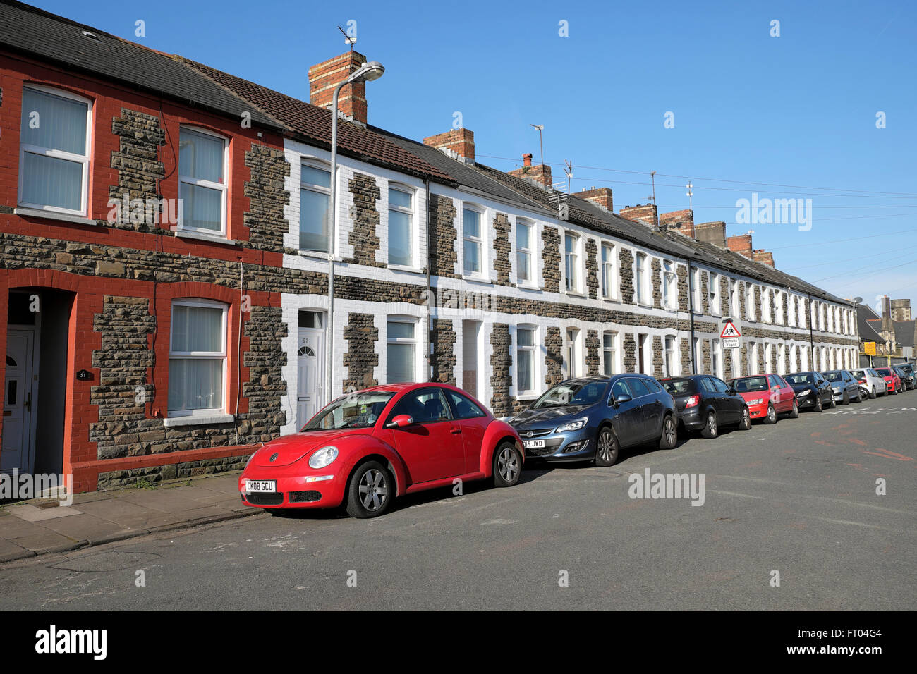 Row of terraced housing and cars parked in a residential street near the University in Cardiff