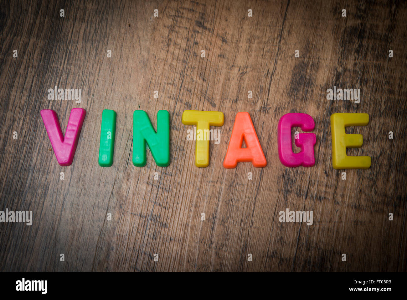 Vintage, spelt out with multi coloured fridge magnet letters Stock Photo