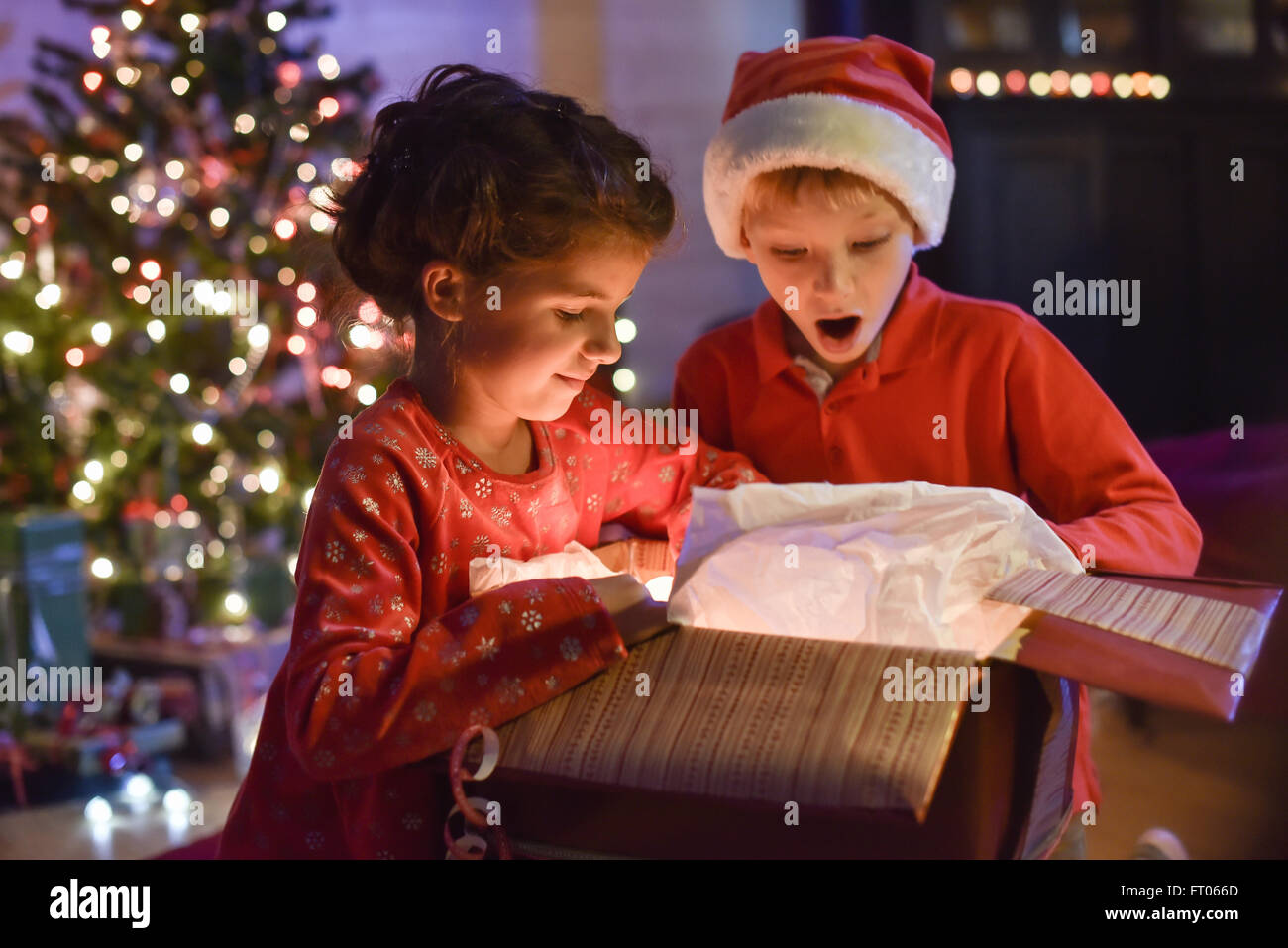 kids opening christmas gifts