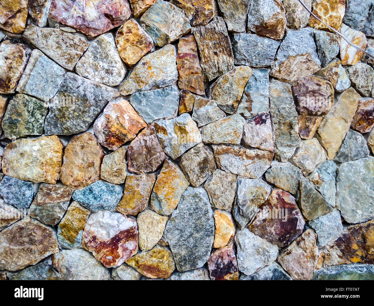 granite stone wall a very hard type of rock that is used in buildings
