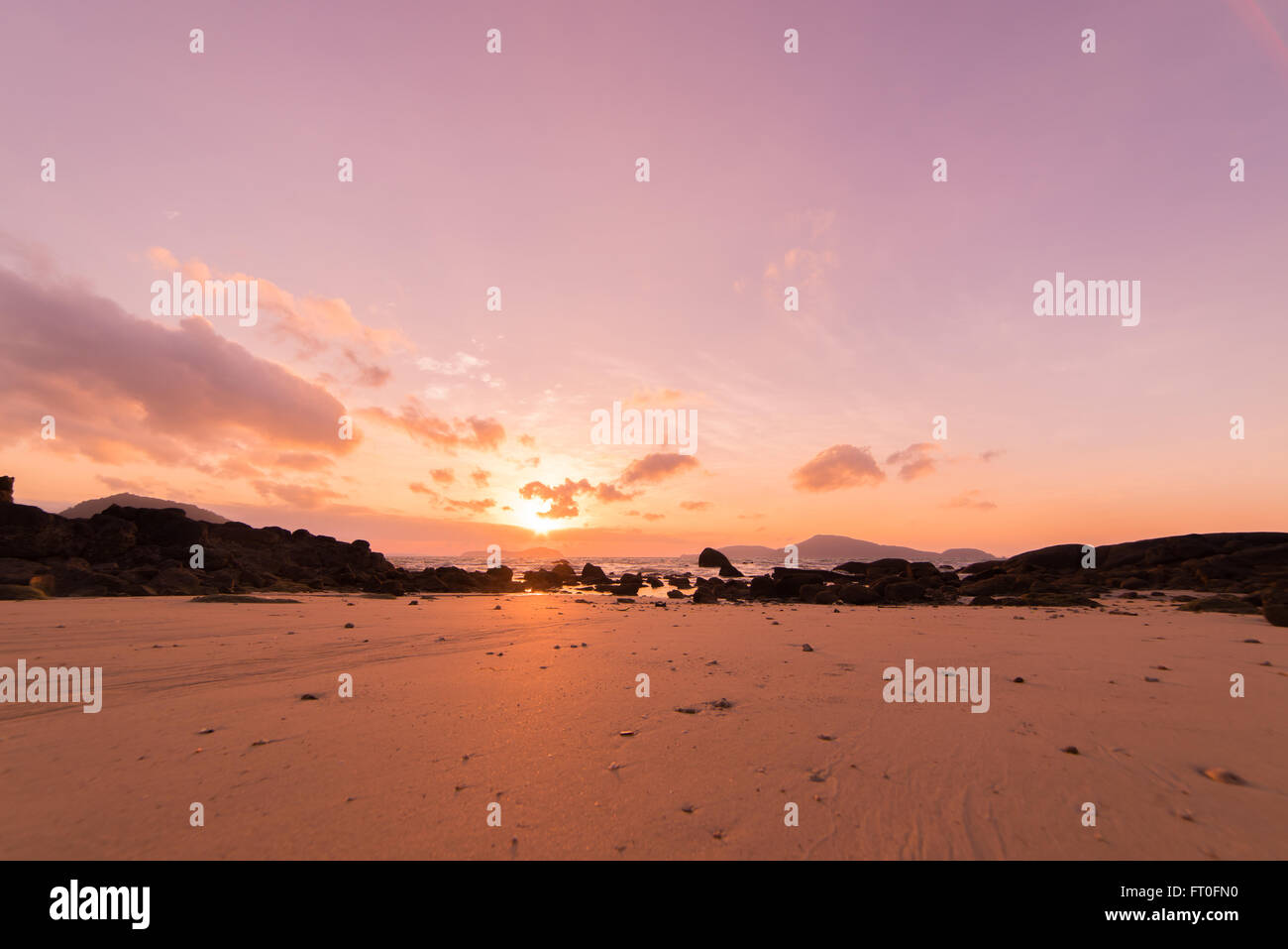 Tropical sunset on the beach in Thailand Stock Photo - Alamy