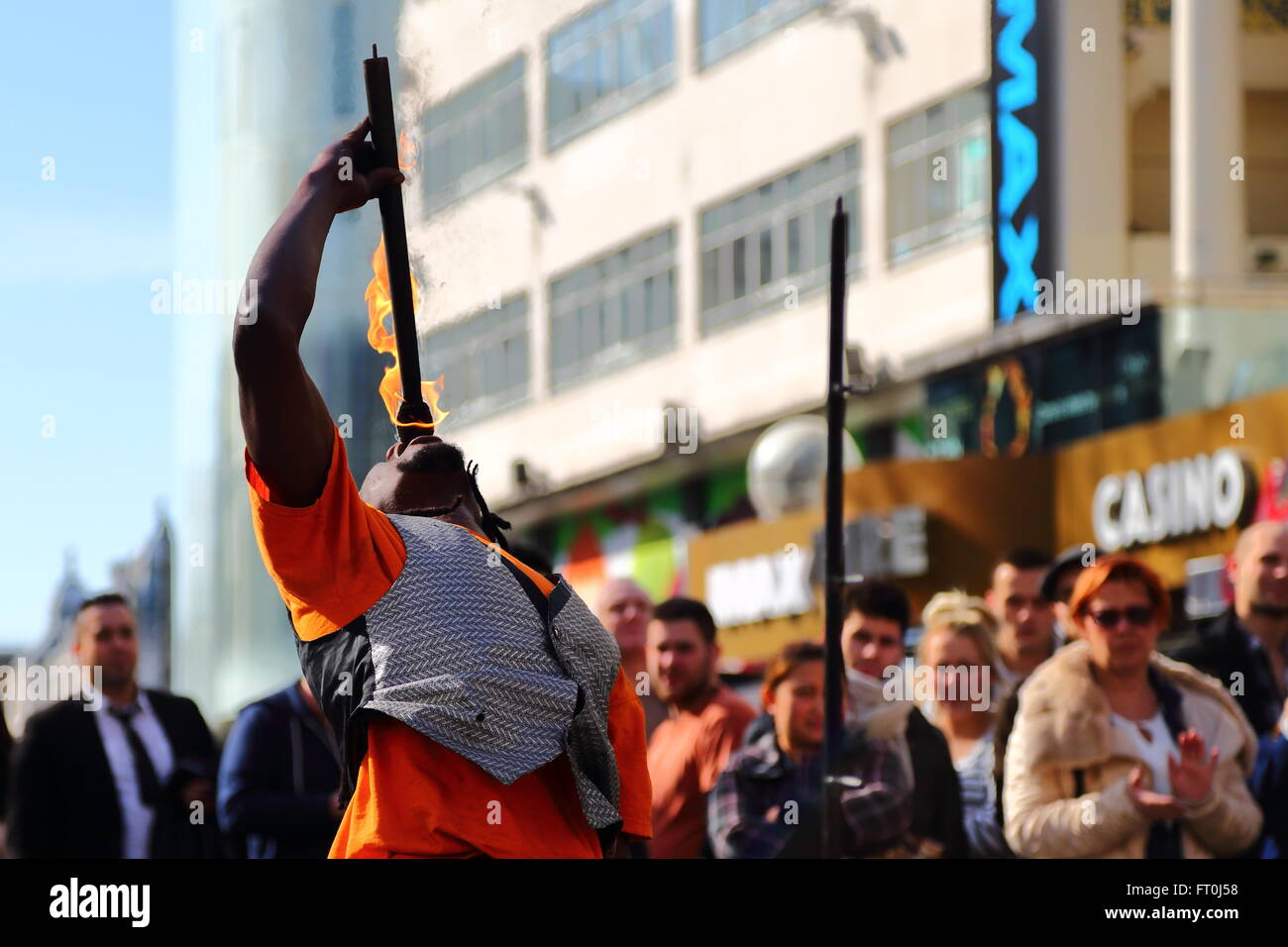 A street performer captures the audience in Leicester Square, London, UK Stock Photo