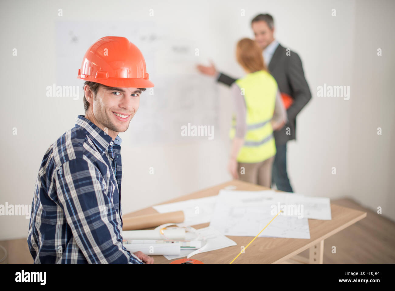 Filing Foreman portrait of a foreman during a meeting about a build project Stock ...