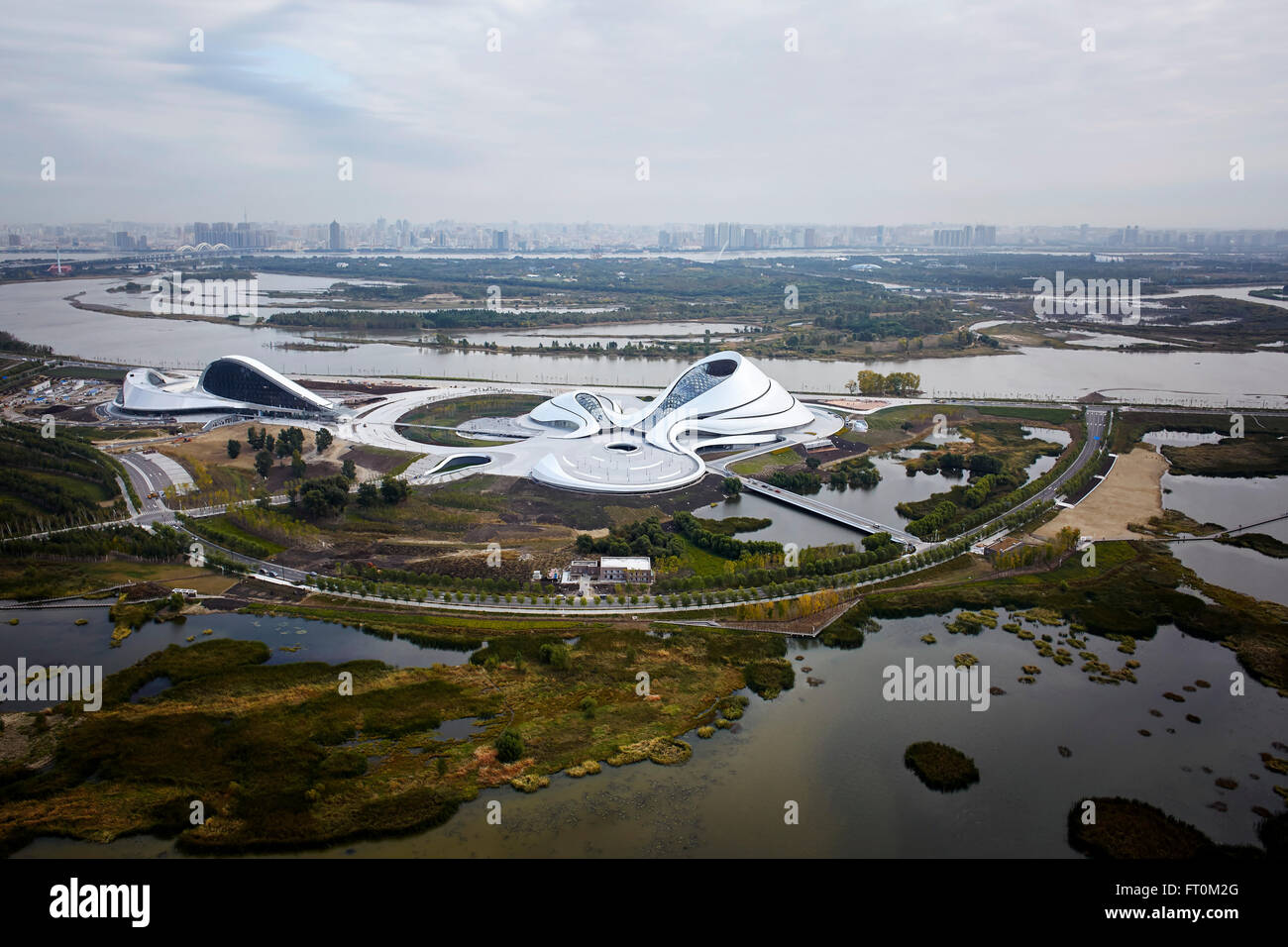 Aerial view of opera house embedded in Harbin's wetland landscape. Harbin Opera House, Harbin, China. Architect: MAD Architects, Stock Photo