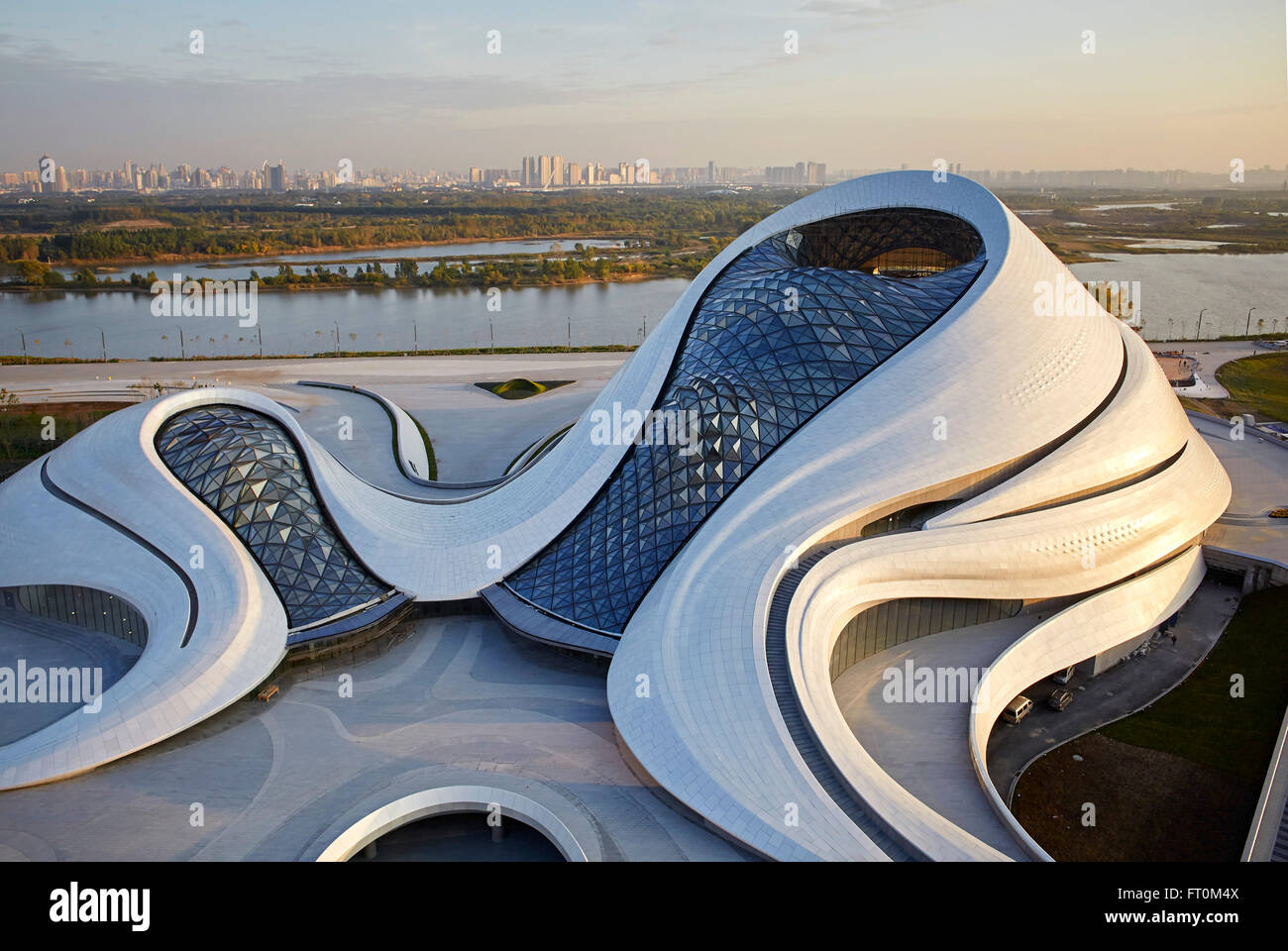 Aerial view of opera house embedded in Harbin's wetland landscape. Harbin Opera House, Harbin