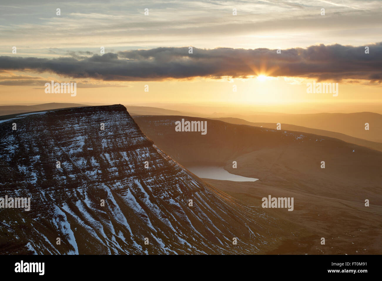 Sun setting over The Black Mountain. Brecon Beacons National Park. Carmarthenshire. Wales. UK. Stock Photo