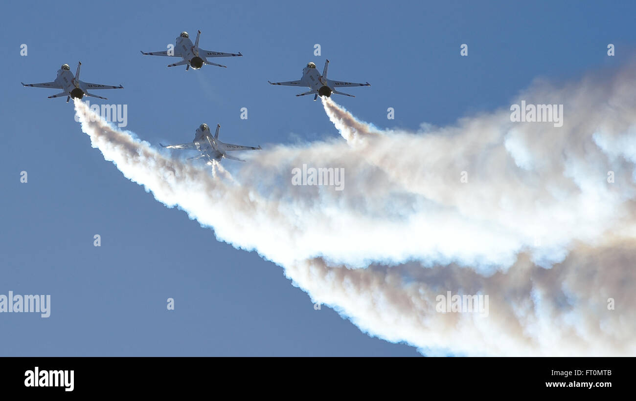 Four F-16 Fighting Falcon Thunderbirds, from the U.S. Air Force Air Demonstration Squadron, fly in a diamond formation during the Thunder and Lightning over Arizona Open House at Davis-Monthan Air Force Base, Ariz., March 12, 2016. The free event featured aerial demonstrations from various teams and numerous static displays. (U.S. Air Force photo by Senior Airman Chris Massey/Released) Stock Photo