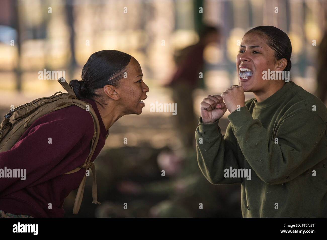 U.S. Marine Corps Sgt. Natalia Arenas, a drill instructor with Platoon 4017, November Company, 4th Recruit Training Battalion, Recruit Training Regiment, instructs a recruit on a technique from the Marine Corps Martial Arts Program at Leatherneck Square, Marine Corps Recruit Depot Parris Island, S.C. March 3, 2016. The Marine Corps Martial Arts Program combines some of the most effective unarmed techniques from various martial arts with armed techniques designed for combat, with the motto one mind, any weapon.  (U.S. Marine Corps photo by Sgt. Nathan McKitrick/Released) Stock Photo