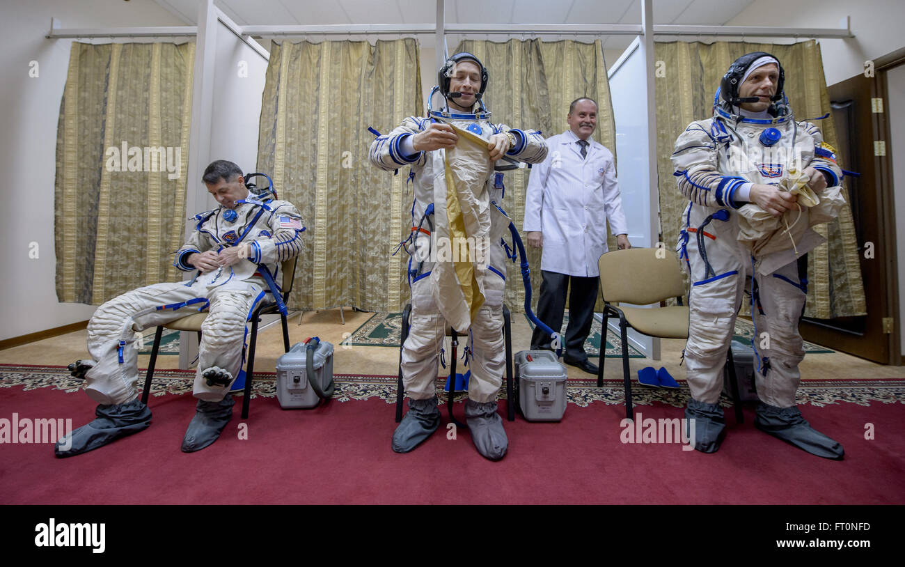 Expedition 47 backup crew members: NASA astronaut Shane Kimbrough, left, Russian cosmonaut Sergei Ryzhikov of Roscosmos, center, and Russian cosmonaut Andre Borisenko of Roscosmos, center, don their Sokol suits ahead of their Soyuz qualification exams, Wednesday, Feb. 24, 2016, at the Gagarin Cosmonaut Training Center (GCTC) in Star City, Russia. Photo Credit: (NASA/Bill Ingalls) Stock Photo