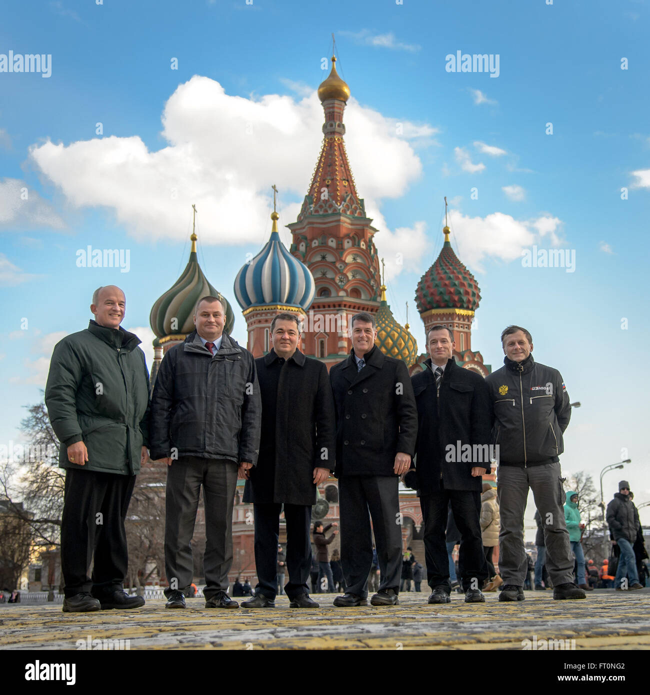 Expedition 47 prime crew members: NASA astronaut Jeff Williams, left, Russian cosmonauts Alexei Ovchinin, and Oleg Skripochka of Roscosmos, and backup crew members, NASA astronaut Shane Kimbrough, Russian cosmonauts Sergei Ryzhikov, and Andre Borisenko of Roscosmos pose for a photograph in front of Saint Basil's Cathedral in Red Square shortly after having laid roses at the site where Russian space icons are interred as part of traditional pre-launch ceremonies Friday, Feb. 26, 2016, Moscow, Russia. Photo Credit: (NASA/Bill Ingalls) Stock Photo