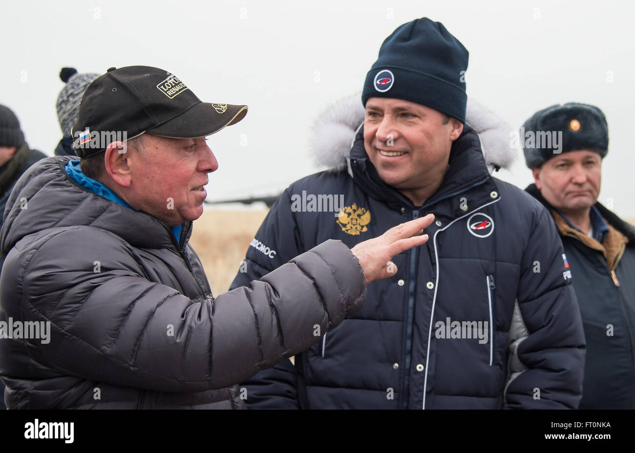 Former cosmonaut and father of Russian cosmonaut Sergey Volkov, Alexander Volkov, left, talks with Head of Roscosmos Igor Komarov as he waits for his son to be extracted from the Soyuz TMA-18M spacecraft with Expedition 46 Commander Scott Kelly of NASA and Russian cosmonaut Mikhail Kornienko near the town of Zhezkazgan, Kazakhstan on Wednesday, March 2, 2016 (Kazakh time). Kelly and Kornienko completed an International Space Station record year-long mission to collect valuable data on the effect of long duration weightlessness on the human body that will be used to formulate a human mission to Stock Photo