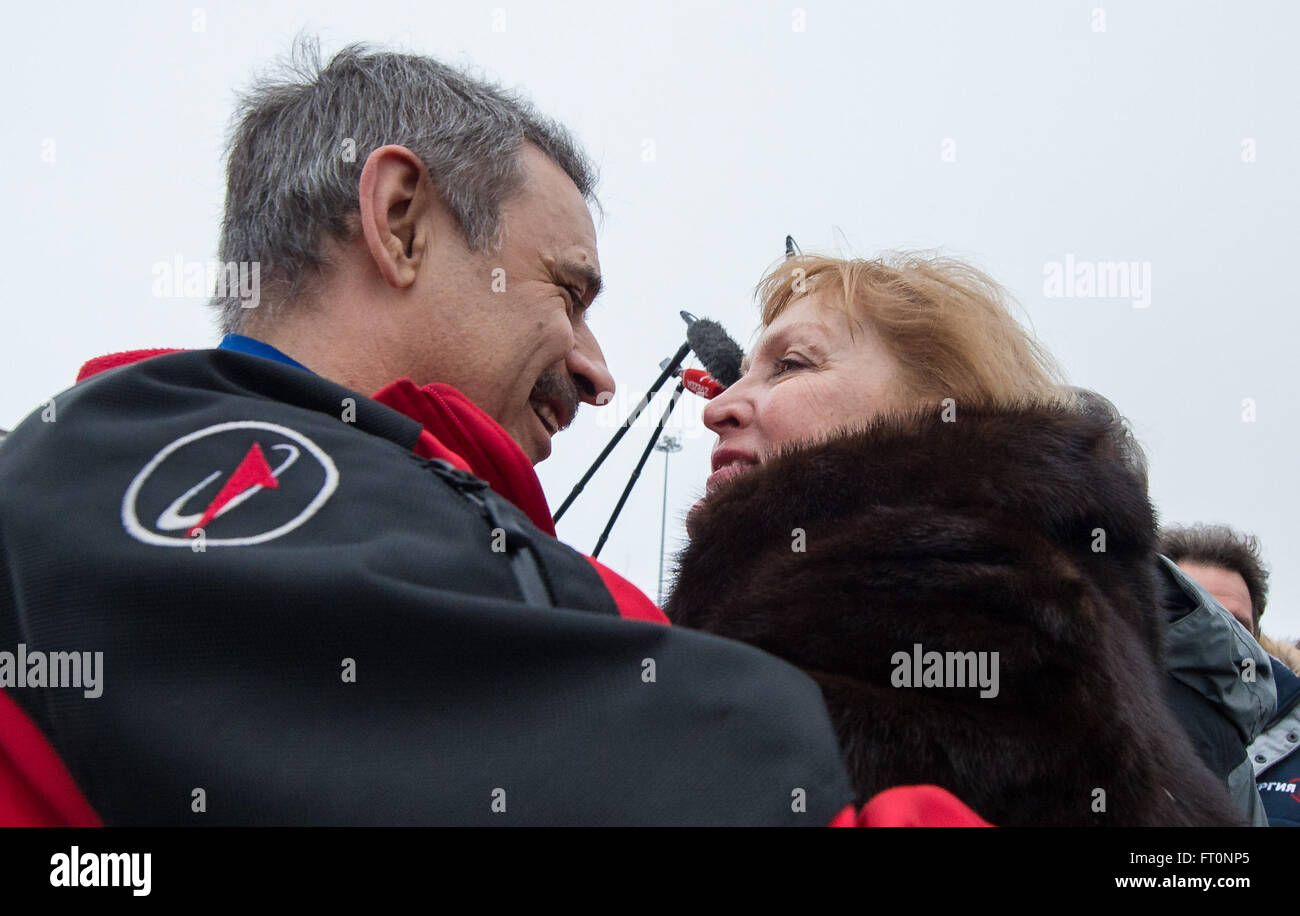 Russian cosmonaut Mikhail Kornienko, is welcomed home by his wife at the Chkalovsky Airport in Star City, Russia several hours after he and Russian cosmonaut Sergey Volkov of Roscosmos and NASA astronaut Scott Kelly landed their Soyuz spacecraft in a remote area outside the town of Zhezkazgan, Kazakhstan, on Wednesday, March 2, 2016.  Kelly and Kornienko completed an International Space Station record year-long mission to collect valuable data on the effect of long duration weightlessness on the human body that will be used to formulate a human mission to Mars. Volkov returned after spending s Stock Photo