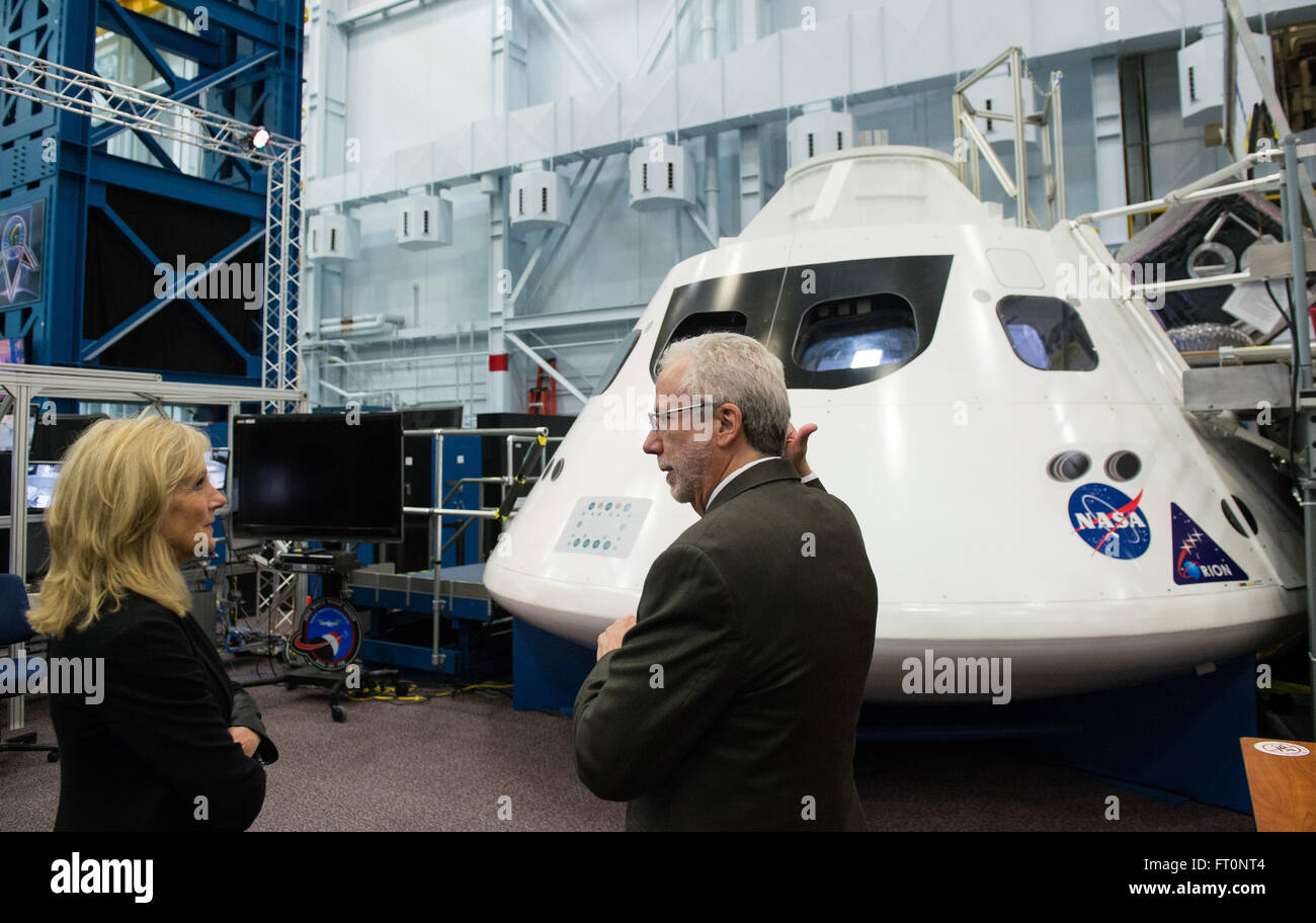 NASA's Mark Geyer discusses the Orion space capsule with Dr. Jill Biden at the Space Vehicle Mockup Facility. The event occurred as part of a visit to welcome astronaut Scott Kelly home after his year-long mission aboard the International Space Station. Stock Photo