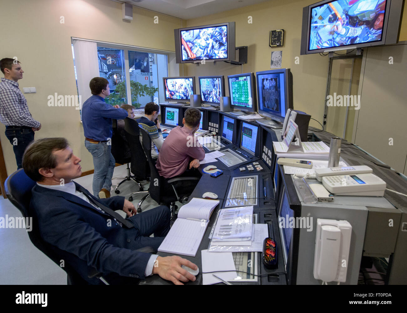 Engineers work in the Soyuz simulator control room as Expedition 47 crew members: NASA astronaut Jeff Williams, Russian cosmonauts Oleg Skripochka, and  Alexei Ovchinin of Roscosmos take their final Soyuz qualification exams, Thursday, Feb. 25, 2016, at the Gagarin Cosmonaut Training Center (GCTC) in Star City, Russia. Stock Photo
