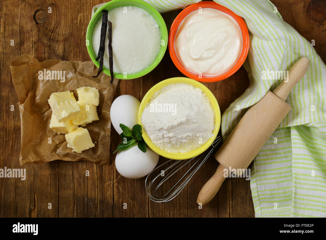 Ingredients for pastry butter, milk, eggs, flour and vanilla sugar on