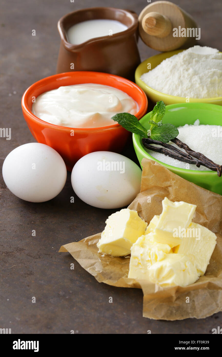 Ingredients for pastry butter, milk, eggs, flour and vanilla sugar on