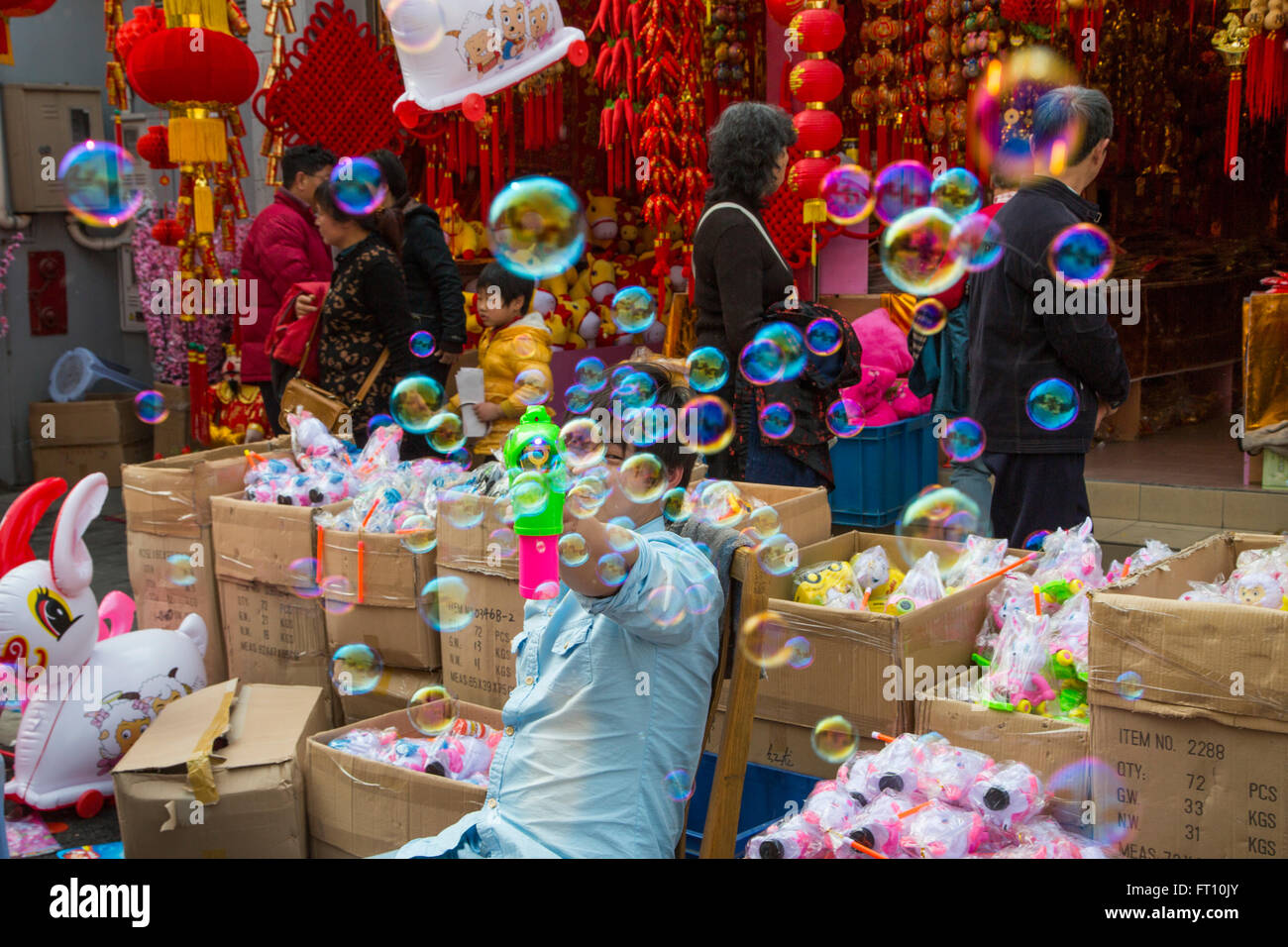 Man with soap bubble toy at a street market near the old town, Nanshi, Shanghai, China Stock Photo