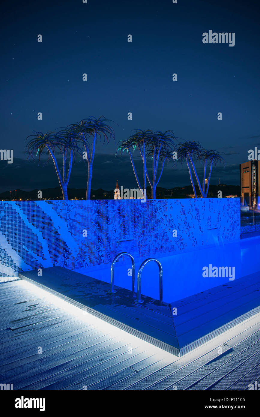 View from the roof terrace from the Hilton Hotel towards Christ Church at night, swimming pool, Windhoek, Namibia, Africa Stock Photo