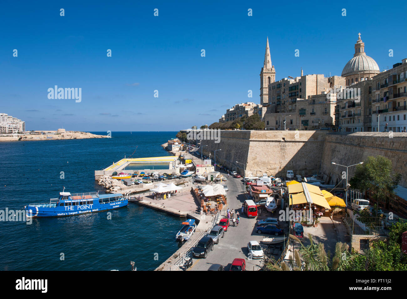Market stalls and Sliema Ferry in harbor, Valletta, Malta Stock Photo