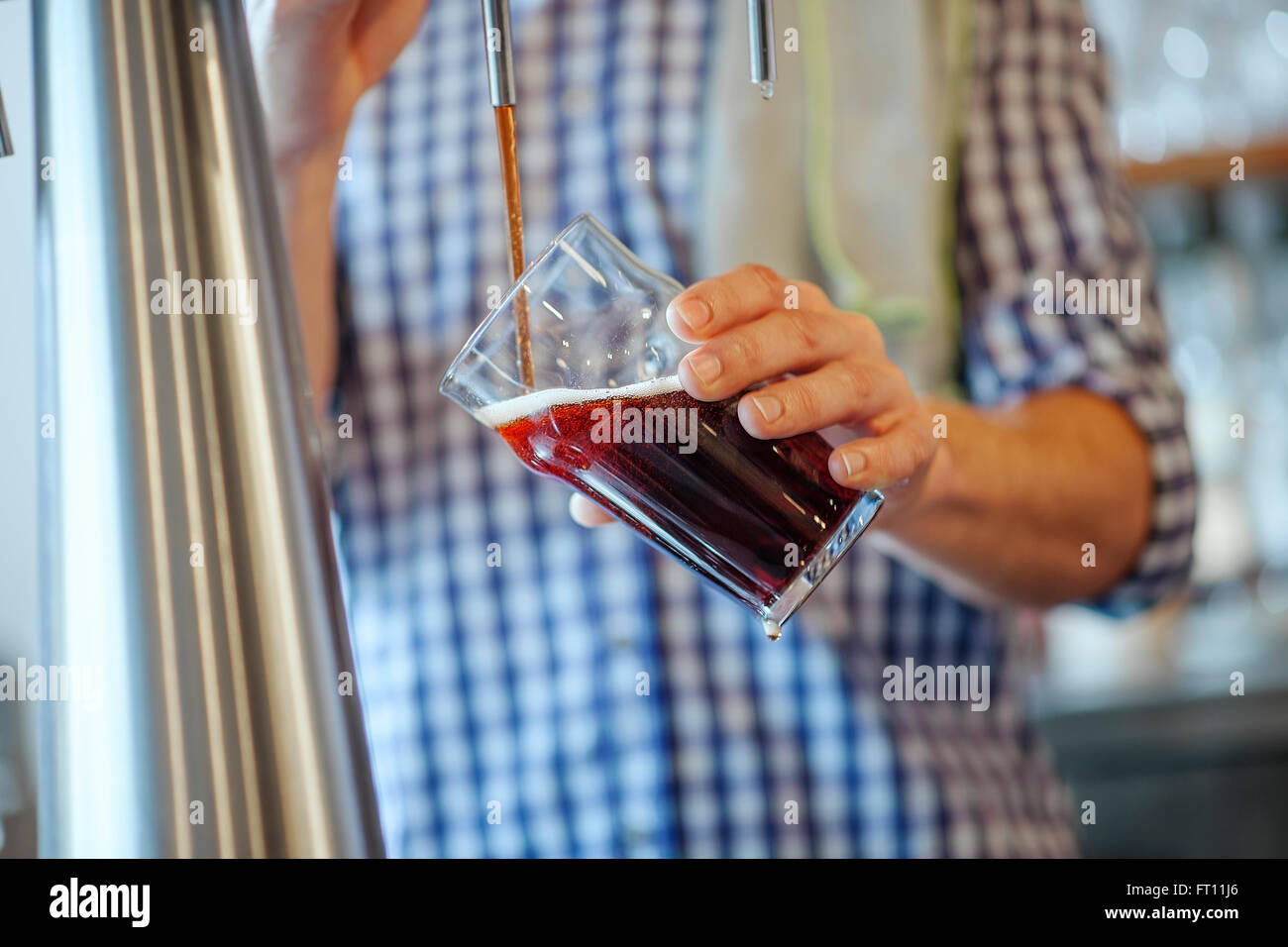 closeup on a barman's hands pulling a beer at pump Stock Photo - Alamy