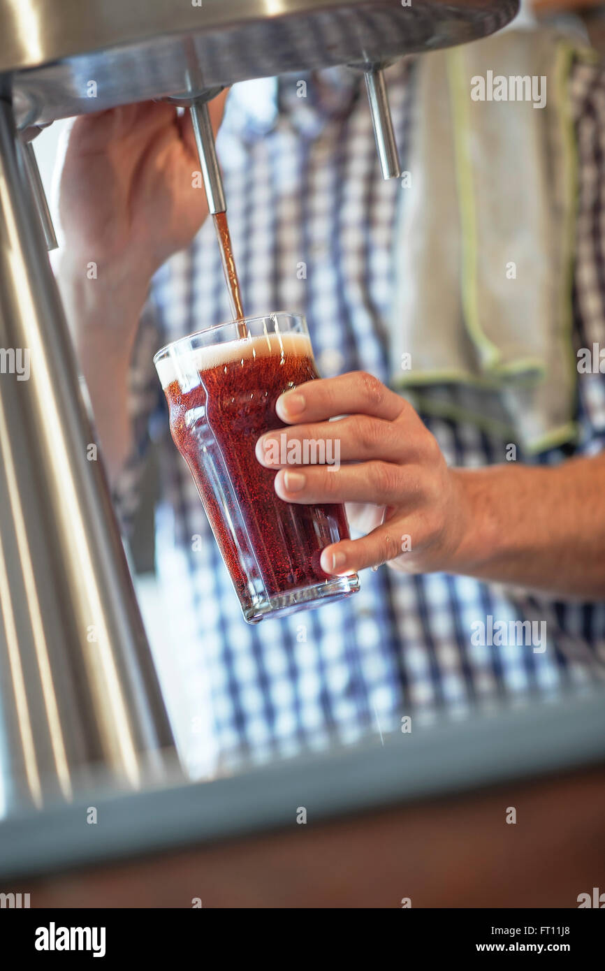 closeup on a barman's hands pulling a beer at pump Stock Photo - Alamy