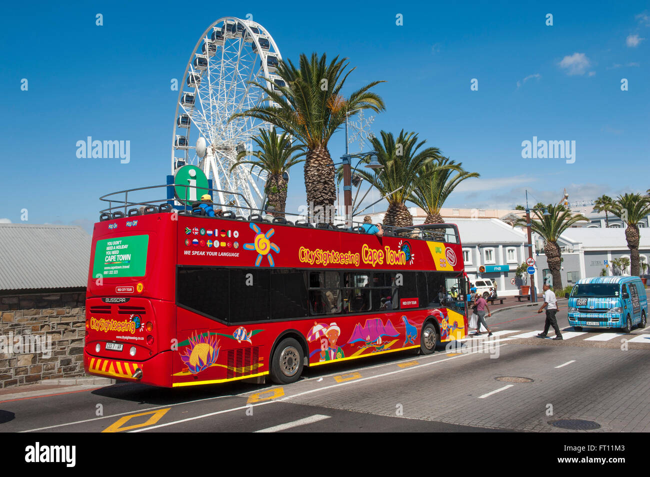 City tour bus, ferris wheel in background, Waterfront, Cape Town, Western Cape, South Africa Stock Photo