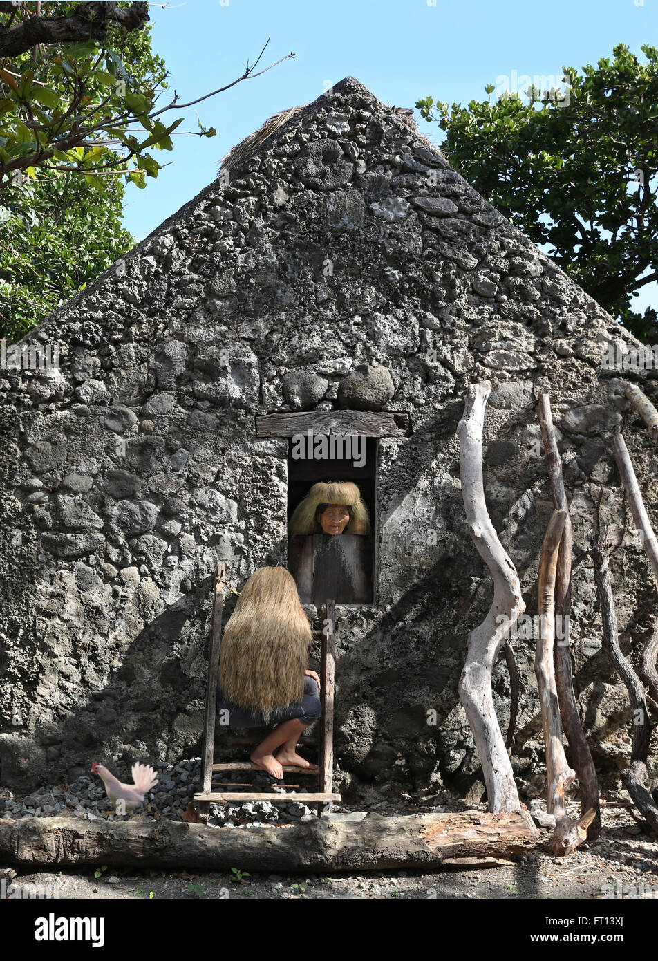Ivatan woman, old stone house in Chavayan, Sabtang Island, Batanes, Philippines, Asia Stock Photo