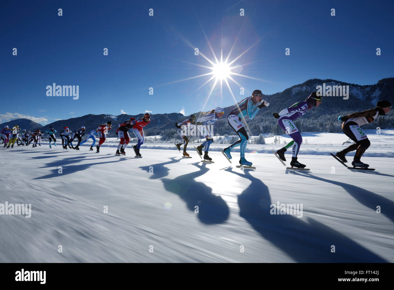 Female ice speed skaters on lake Weissensee, Alternative Eleven cities tour, Weissensee, Carinthia, Austria Stock Photo