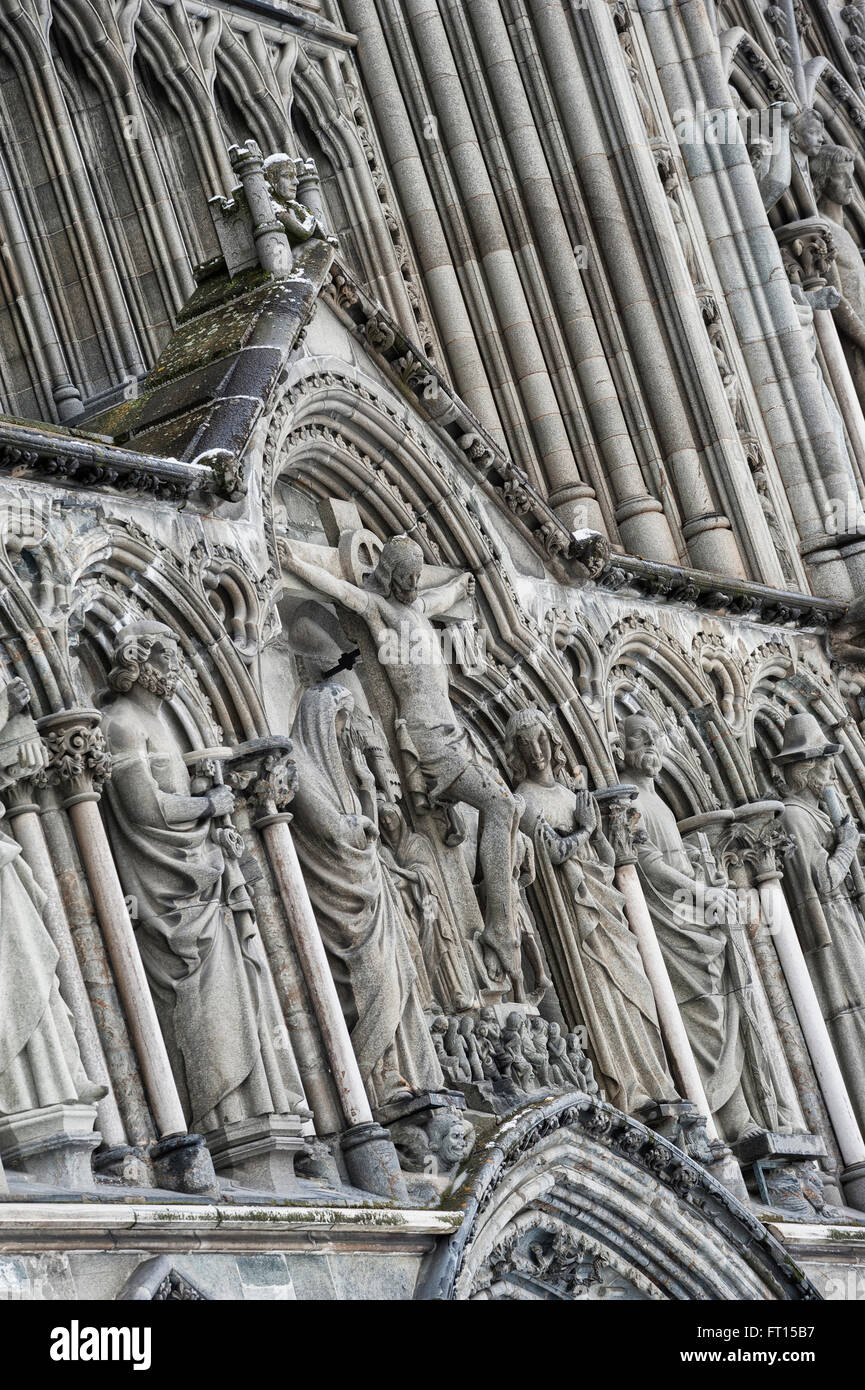 Crucifixion group: Mary, Jesus and John statue on Nidaros Cathedral West Front. Trondheim. Norway. Europe Stock Photo